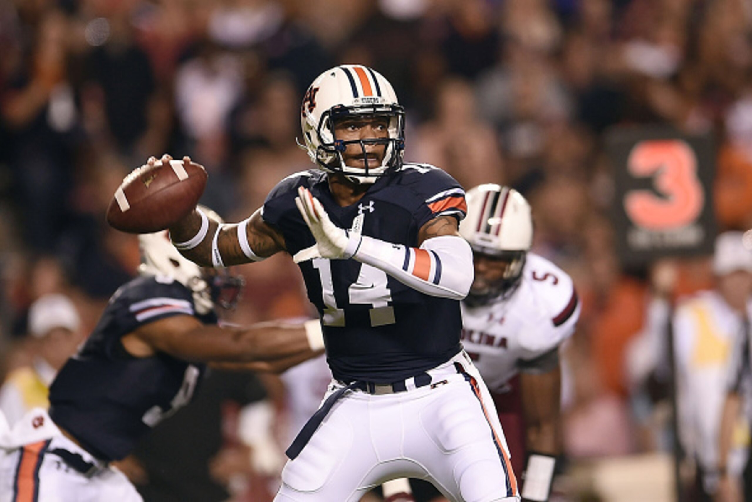 AUBURN, AL - OCTOBER 25:  Nick Marshall #14 of the Auburn Tigers looks to pass against the South Carolina Gamecocks during the first quarter of a game at Jordan Hare Stadium on October 25, 2014 in Auburn, Alabama.  (Photo by Stacy Revere/Getty Images)