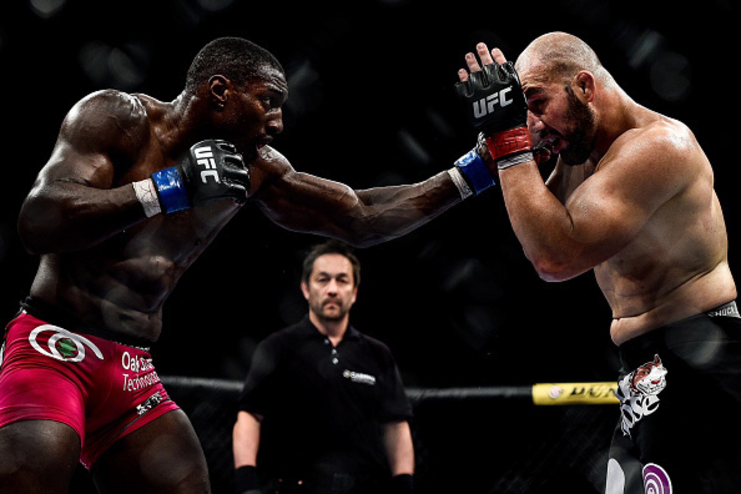 RIO DE JANEIRO, BRAZIL - OCTOBER 25:  Phil Davis of the United States punches Glover Teixeira of Brazil in their light heavyweight bout during the UFC 179 event at Maracanazinho on October 25, 2014 in Rio de Janeiro, Brazil.  (Photo by Buda Mendes/Getty I