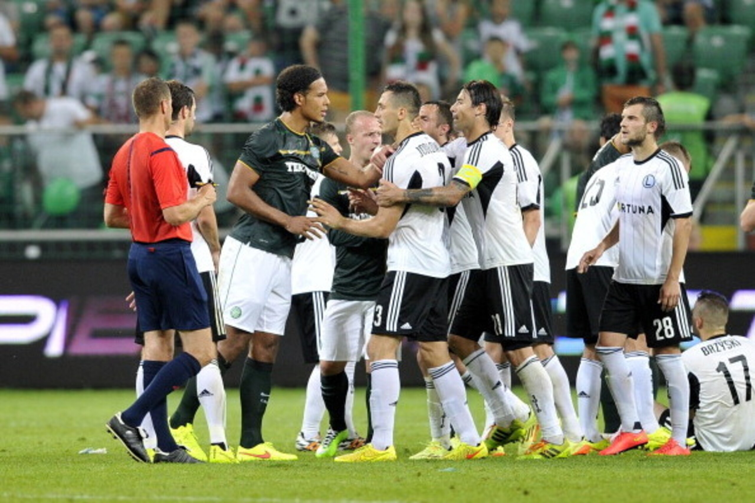 WARSAW, POLAND Ð JULY 30: Virgil Van Dijk of Celtic discuses with Tomasz Jodlowiec of Legia during the third qualifying round UEFA Champions League match between Legia and Celtic at Pepsi Arena on July 30, 2014 in Warsaw, Poland. (Photo by Piotr Hawalej/G