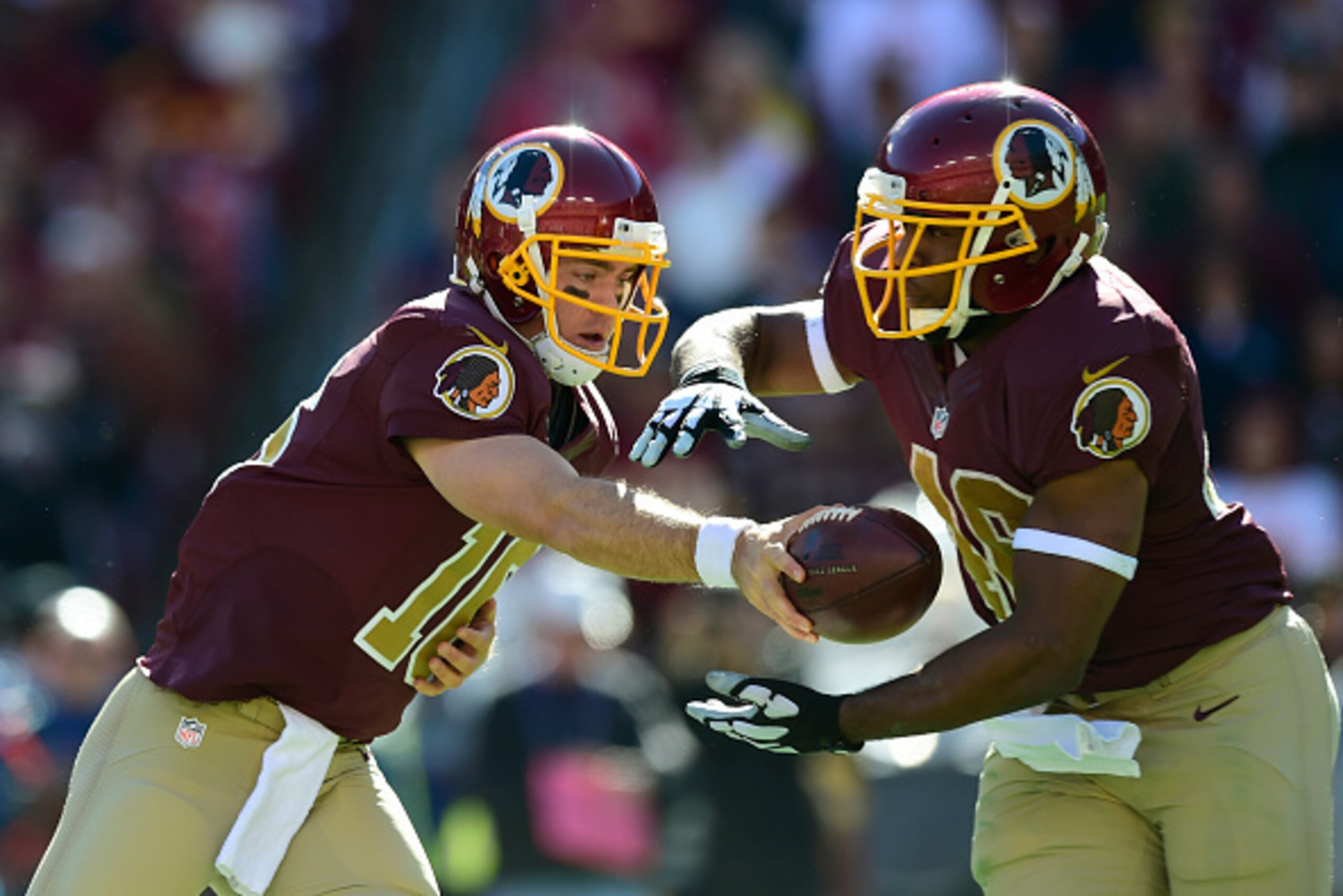 LANDOVER, MD - OCTOBER 19:  Colt McCoy #16 of the Washington Redskins hands off to Alfred Morris #46 of the Washington Redskins during third quarter against the Tennessee Titans at FedEx Field on October 19, 2014 in Landover, Maryland.  (Photo by Patrick 