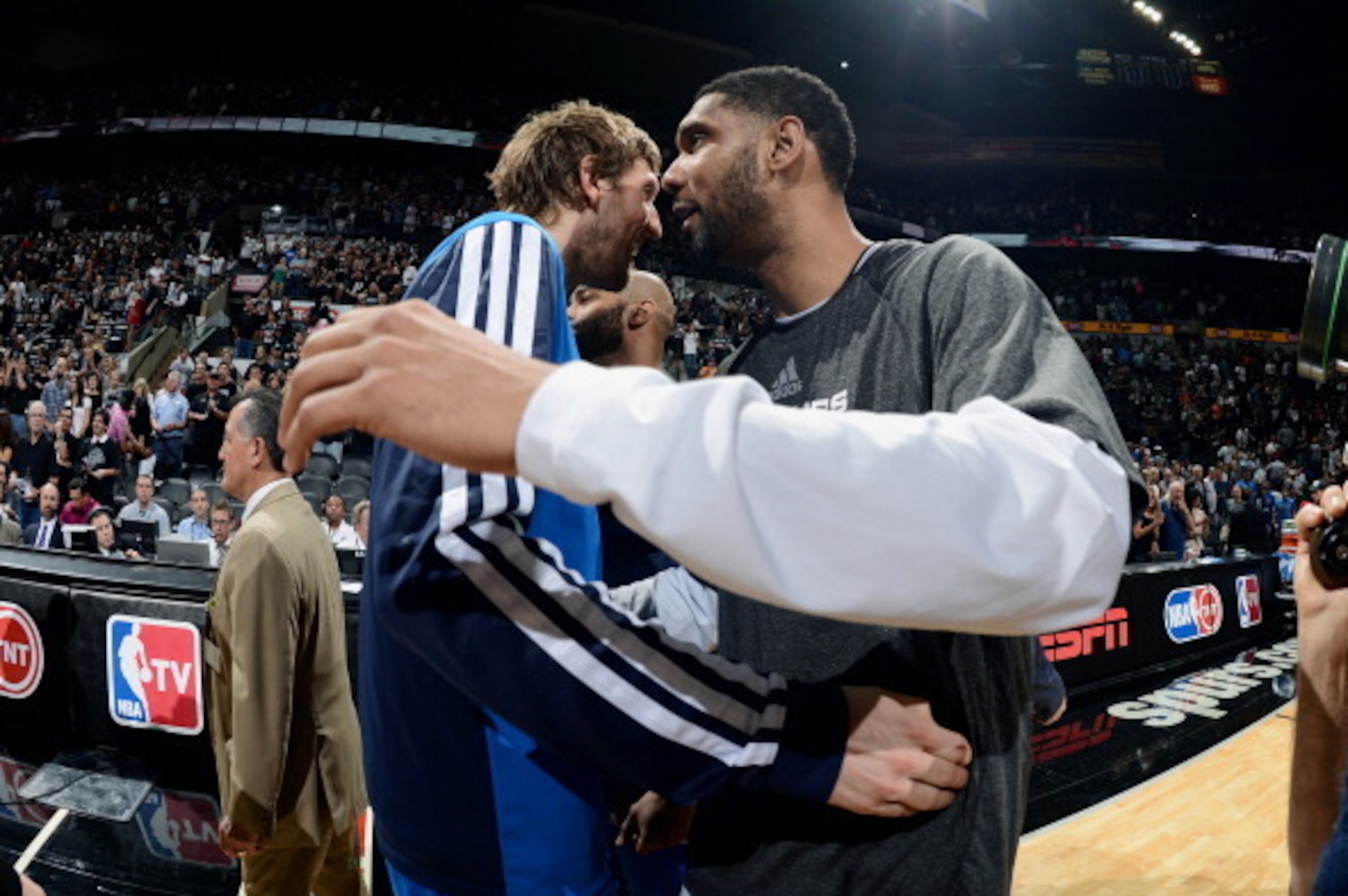 SAN ANTONIO, TX - MAY 5: Dirk Nowitzki #41 of the Dallas Mavericks hugs Tim Duncan #21 of the San Antonio Spurs in Game Seven of the Western Conference Quarterfinals during the 2014 NBA Playoffs on May 5, 2014 at the AT&T Center in San Antonio, Texas. NOT SAN ANTONIO, TX - MAY 5: Dirk Nowitzki #41 of the Dallas Mavericks hugs Tim Duncan #21 of the San Antonio Spurs in Game Seven of the Western Conference Quarterfinals during the 2014 NBA Playoffs on May 5, 2014 at the AT&T Center in San Antonio, Texas. NOT