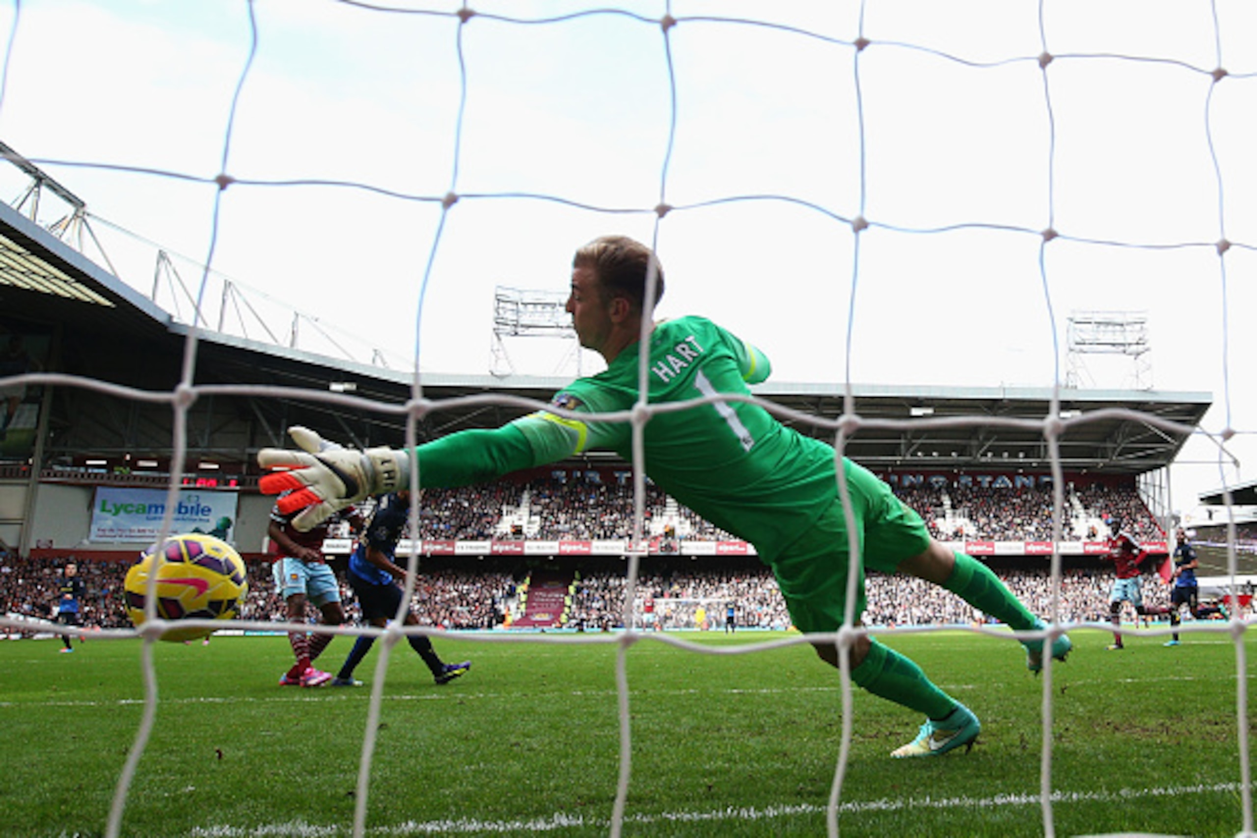 LONDON, ENGLAND - OCTOBER 25:  Joe Hart of Manchester City fails to stop the header by Diafra Sakho of West Ham United during the Barclays Premier League match between West Ham United and Manchester City at Boleyn Ground on October 25, 2014 in London, Eng