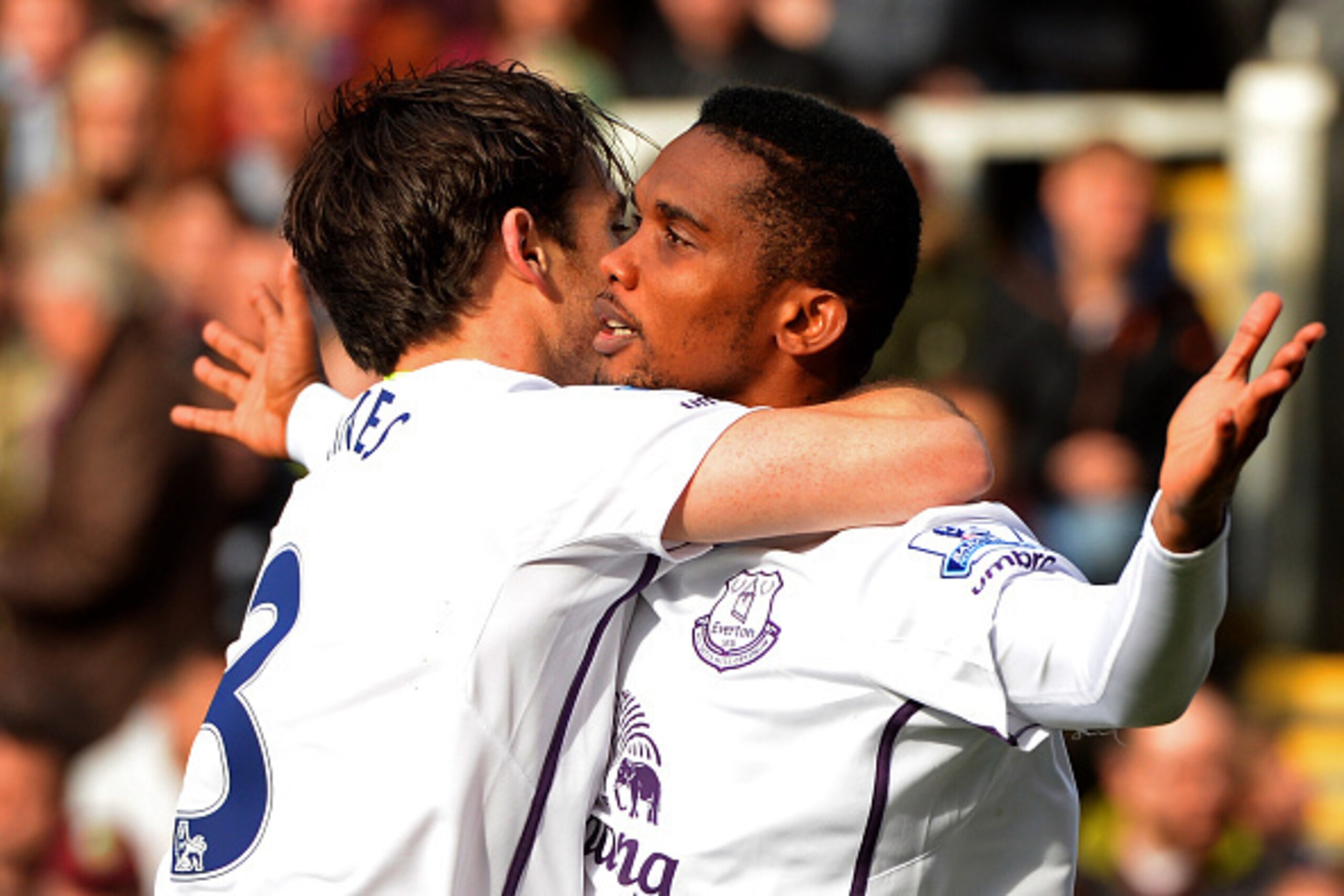 BURNLEY, ENGLAND - OCTOBER 26:  Samuel Eto'o of Everton celebrates with team-mate Leighton Baines after scoring the opening goal during the Premier League match between Burnley and Everton at Turf Moor on October 26, 2014 in Burnley, England.  (Photo by G