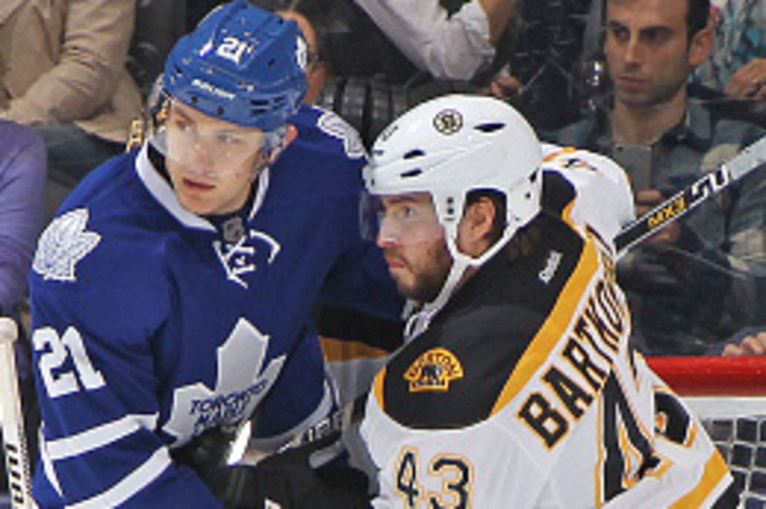 TORONTO, ON - OCTOBER 25:  Matt Bartkowski #43 of the Boston Bruins battles against James van Riemsdyk #21 of the Toronto Maple Leafs during an NHL game at the Air Canada Centre on October 25, 2014 in Toronto, Ontario, Canada. The Bruins defeated the Leaf