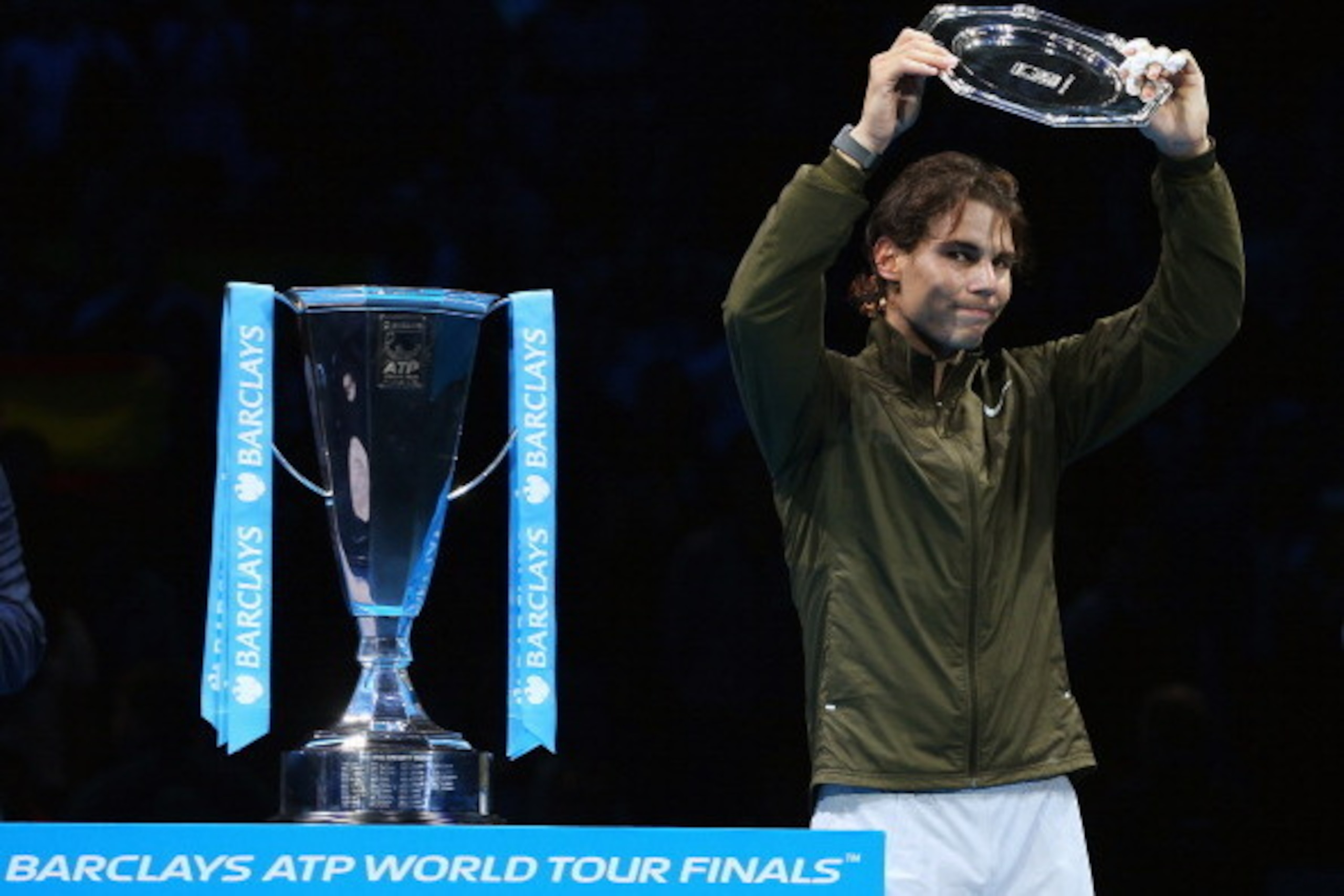 LONDON, ENGLAND - NOVEMBER 11:  Rafael Nadal of Spain collects his runners up trophy after defeat in his men's singles final match against Novak Djokovic of Serbia during day eight of the Barclays ATP World Tour Finals at O2 Arena on November 11, 2013 in 