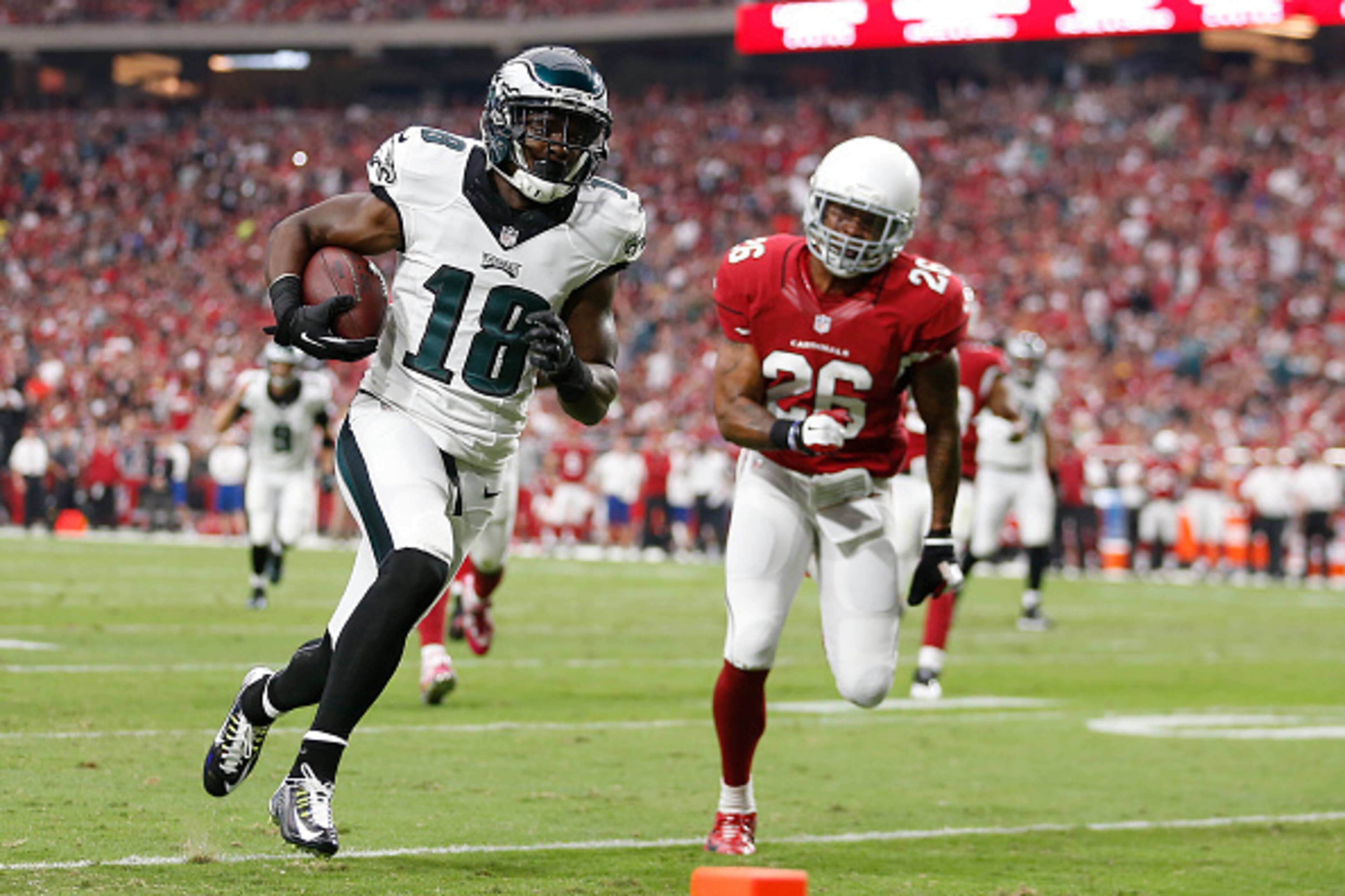 GLENDALE, AZ - OCTOBER 26:  Wide receiver Jeremy Maclin #18 of the Philadelphia Eagles runs with the football in route to score a 21 yard reception against free safety Rashad Johnson #26 of the Arizona Cardinals in the first quarter of the NFL game at the