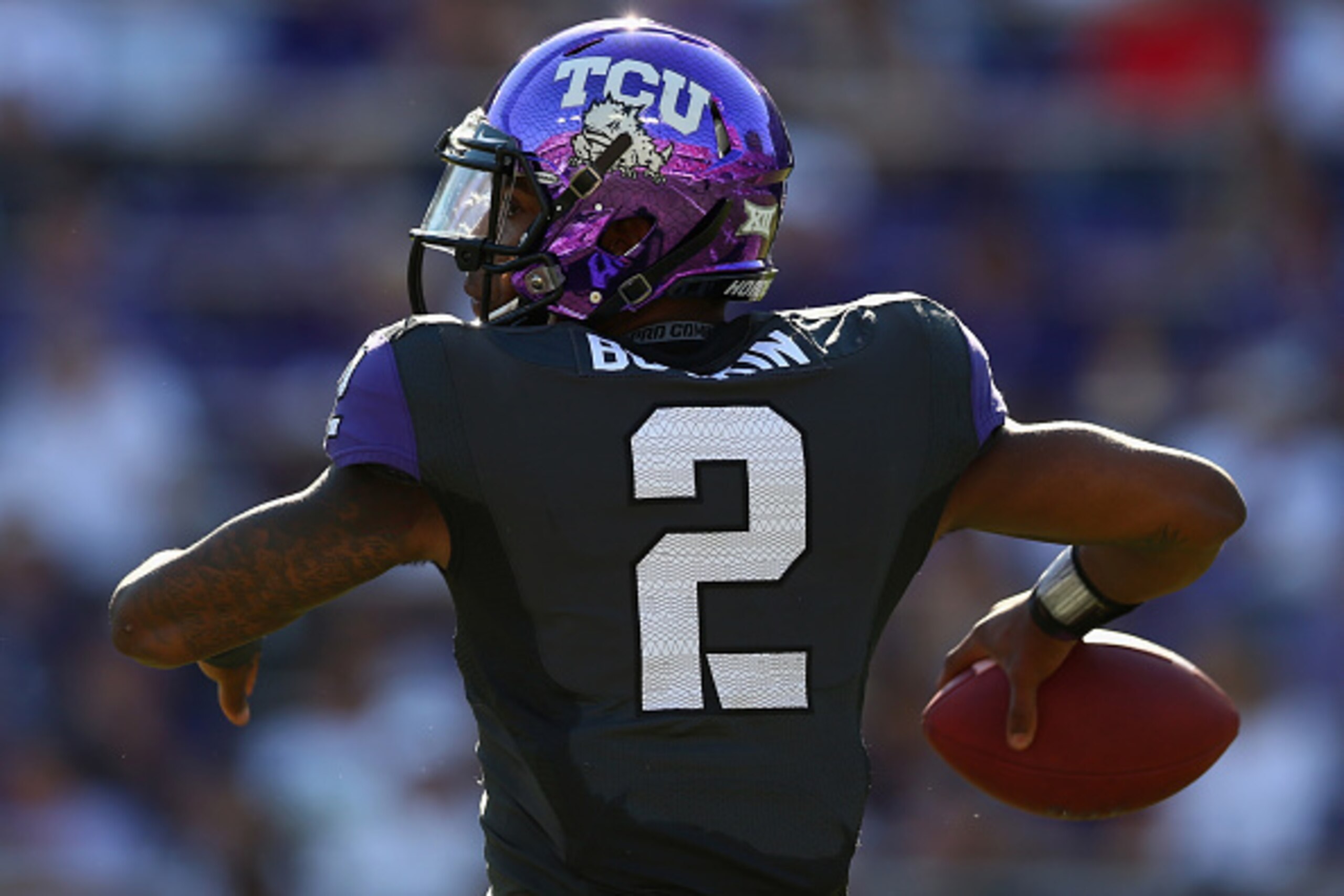 FORT WORTH, TX - OCTOBER 25:  Trevone Boykin #2 of the TCU Horned Frogs throws the ball against the Texas Tech Red Raiders in the second quarter at Amon G. Carter Stadium on October 25, 2014 in Fort Worth, Texas.  (Photo by Ronald Martinez/Getty Images)