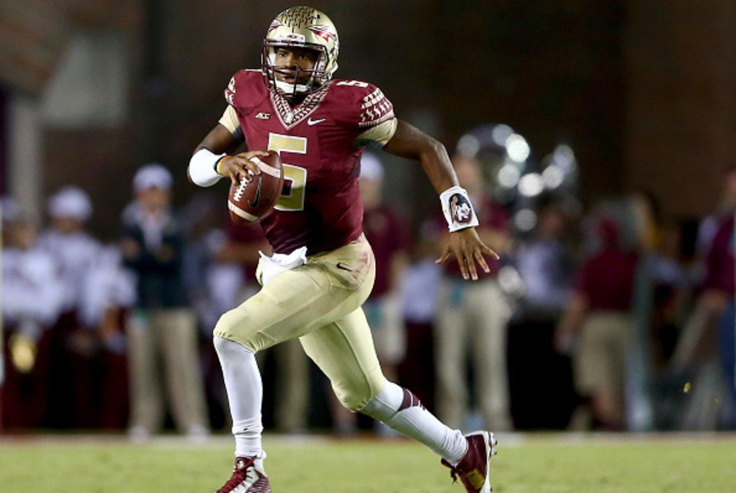 TALLAHASSEE, FL - OCTOBER 18:  Jameis Winston #5 of the Florida State Seminoles runs with the ball against the Notre Dame Fighting Irish during their game at Doak Campbell Stadium on October 18, 2014 in Tallahassee, Florida.  (Photo by Streeter Lecka/Gett