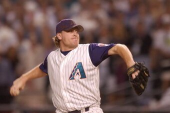 4 Nov 2001: Curt Schilling #38 of the Arizona Diamondbacks delivers in the top of the first inning against the New York Yankees during game seven of the Major League Baseball World Series at Bank One Ballpark in Phoenix, Arizona. The Diamondbacks won 3-2 