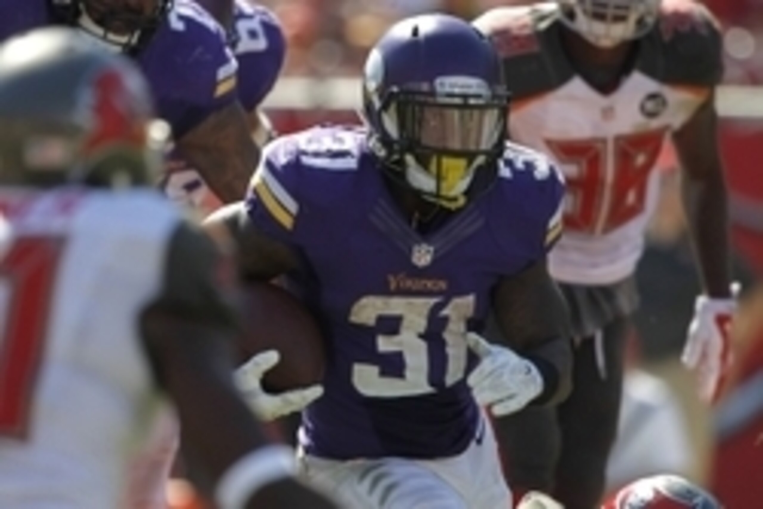 Oct 26, 2014; Tampa, FL, USA; Minnesota Vikings running back Jerick McKinnon (31) runs with the ball against the Tampa Bay Buccaneers during the second half at Raymond James Stadium. Minnesota Vikings defeated the Tampa Bay Buccaneers 19-13. Mandatory Cre Oct 26, 2014; Tampa, FL, USA; Minnesota Vikings running back Jerick McKinnon (31) runs with the ball against the Tampa Bay Buccaneers during the second half at Raymond James Stadium. Minnesota Vikings defeated the Tampa Bay Buccaneers 19-13. Mandatory Cre