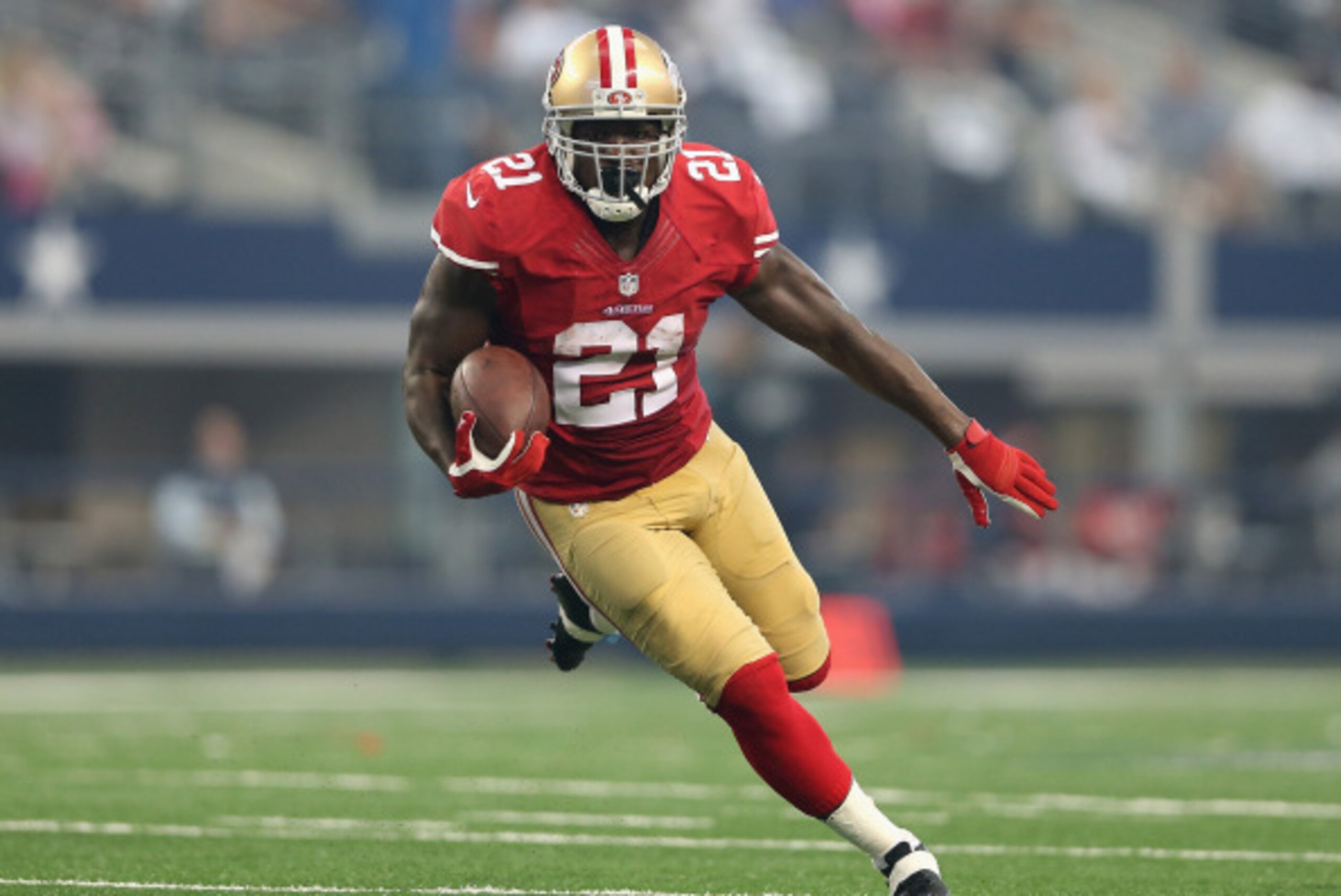ARLINGTON, TX - SEPTEMBER 07:  Running back Frank Gore #21 of the San Francisco 49ers rushes the football against the Dallas Cowboys during the NFL game at AT&T Stadium on September 7, 2014 in Arlington, Texas. The 49ers defeated the Cowboys 28-17.  (Phot