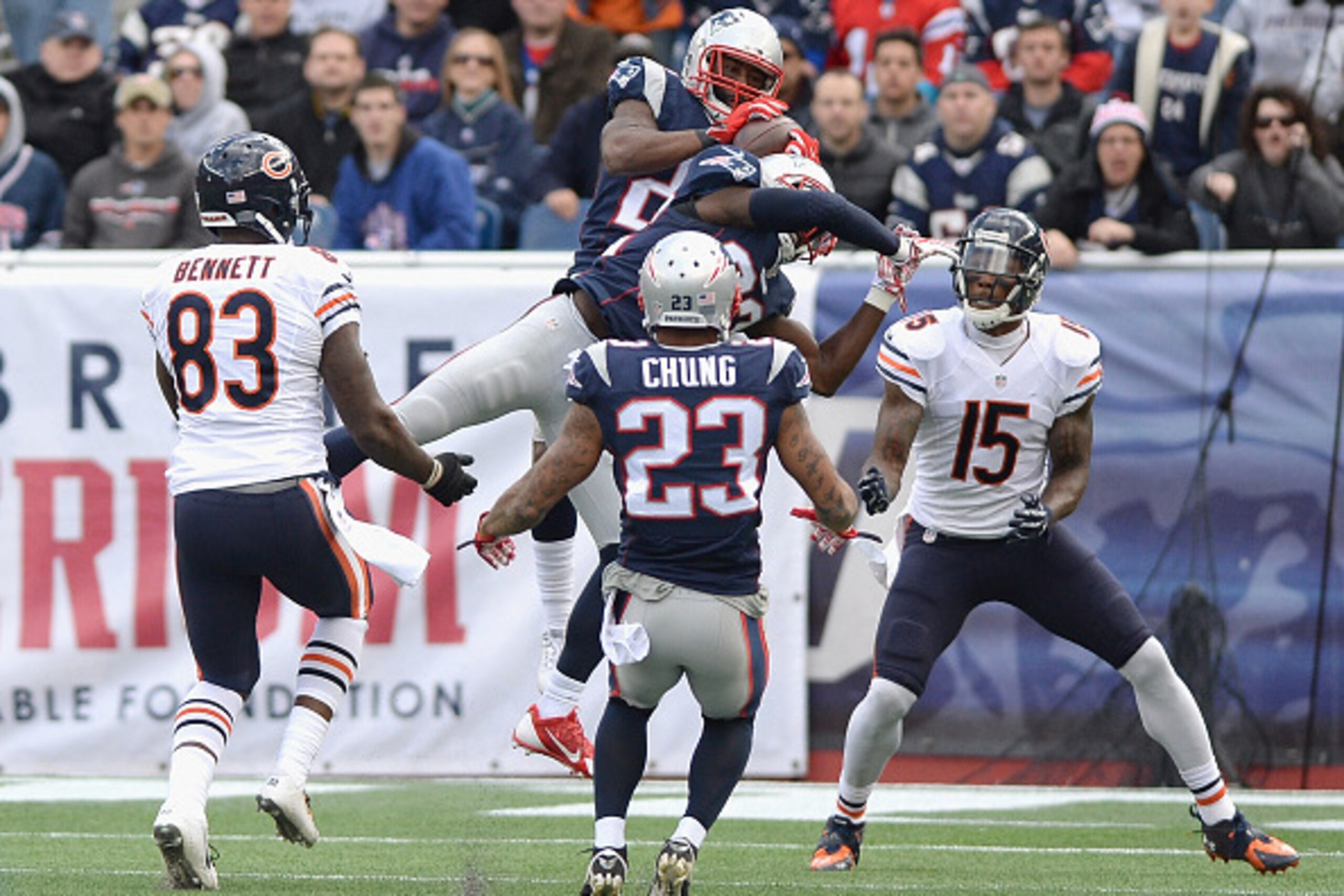 FOXBORO, MA - OCTOBER 26:  Darrelle Revis #24 of the New England Patriots intercepts a pass during the second quarter against the Chicago Bears at Gillette Stadium on October 26, 2014 in Foxboro, Massachusetts.  (Photo by Darren McCollester/Getty Images)