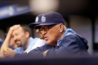 ST. PETERSBURG, FL - SEPTEMBER 19:  Manager Joe Maddon #70 of the Tampa Bay Rays looks on from the dugout during the first inning of a game against the Chicago White Sox on September 19, 2014 at Tropicana Field in St. Petersburg, Florida.  (Photo by Brian