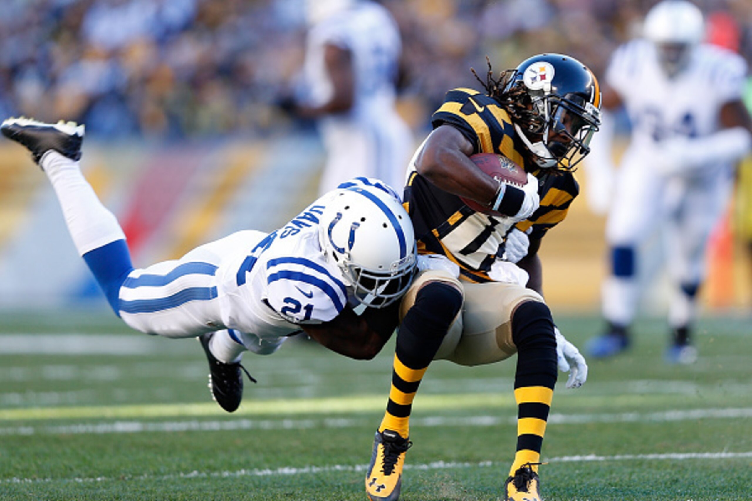 PITTSBURGH, PA - OCTOBER 26:  Markus Wheaton #11 of the Pittsburgh Steelers gets wrapped up by Vontae Davis #21 of the Indianapolis Colts during the first quarter at Heinz Field on October 26, 2014 in Pittsburgh, Pennsylvania.  (Photo by Joe Robbins/Getty