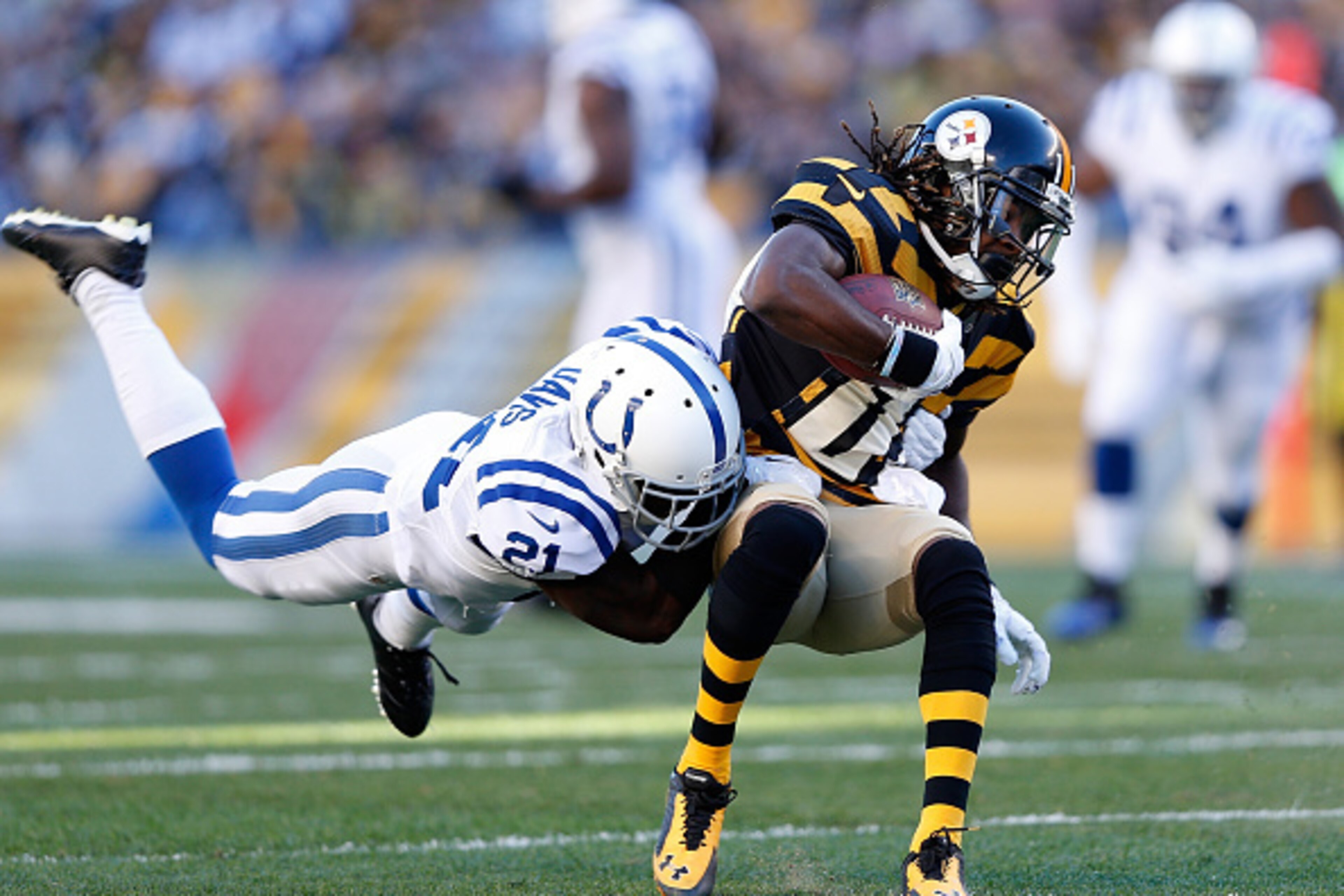 PITTSBURGH, PA - OCTOBER 26:  Markus Wheaton #11 of the Pittsburgh Steelers gets wrapped up by Vontae Davis #21 of the Indianapolis Colts during the first quarter at Heinz Field on October 26, 2014 in Pittsburgh, Pennsylvania.  (Photo by Joe Robbins/Getty