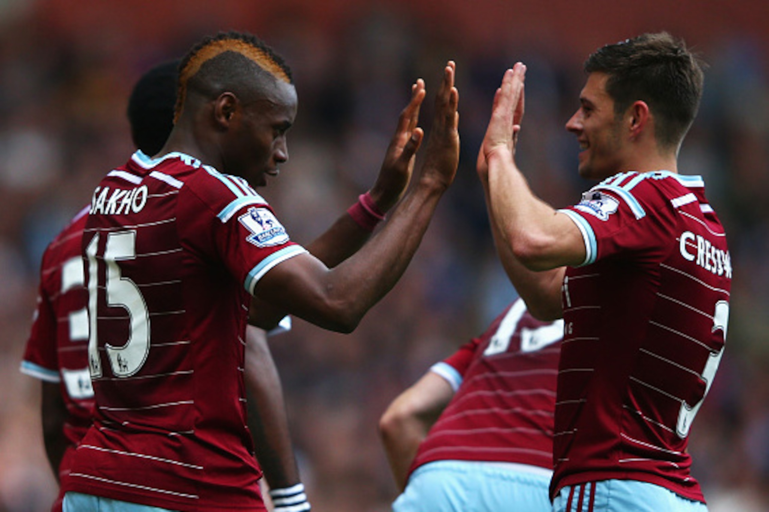 LONDON, ENGLAND - OCTOBER 25:  Diafra Sakho (L) of West Ham United celebrates scoring his team's second goal with Aaron Cresswell of West Ham United during the Barclays Premier League match between West Ham United and Manchester City at Boleyn Ground on O