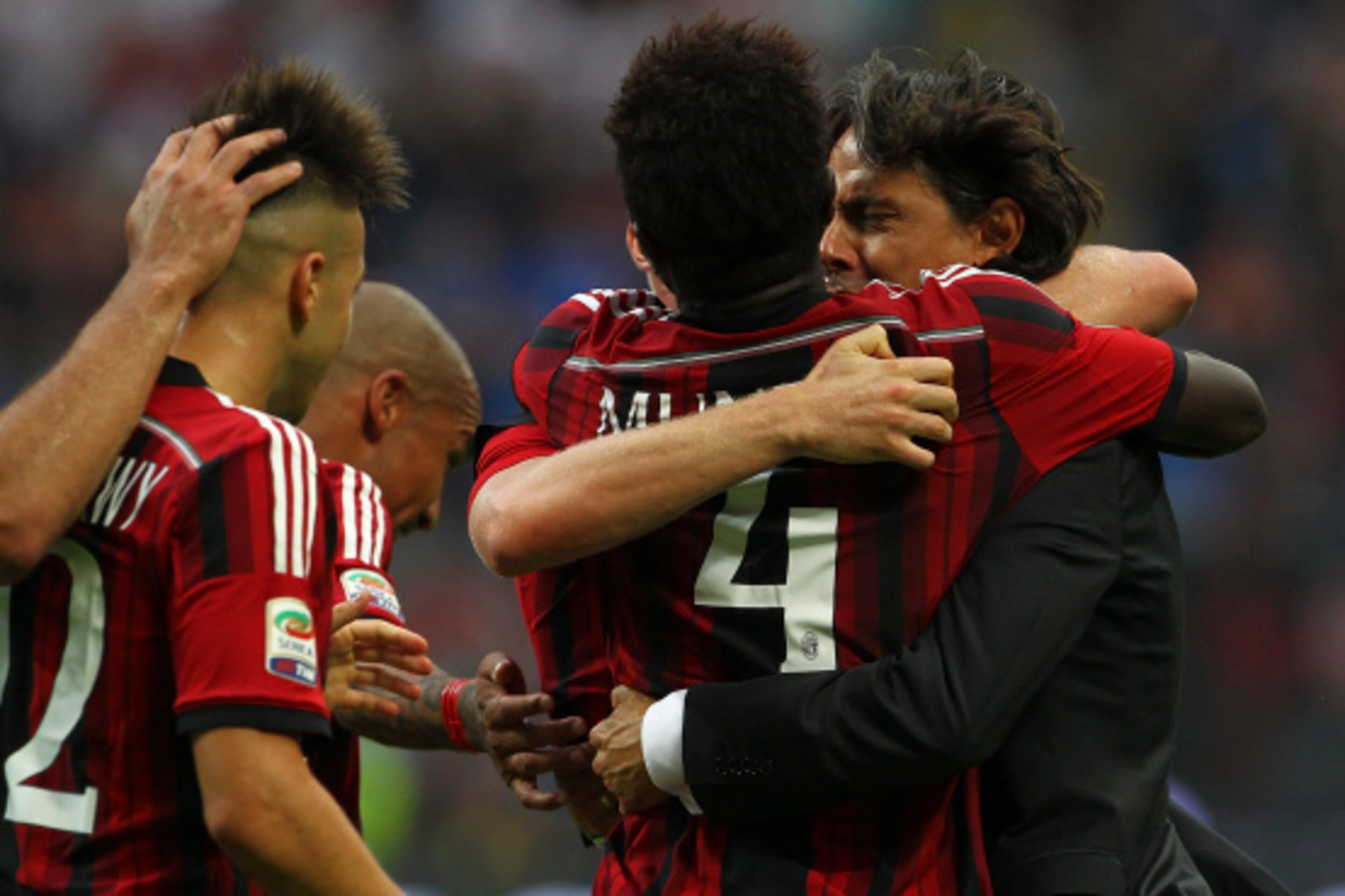MILAN, ITALY - AUGUST 31:  Sulley Ali Muntari #4 of AC Milan celebrates with his coach Filippo Inzaghi after scoring his goal during the Serie A match between AC Milan and SS Lazio at Stadio Giuseppe Meazza on August 31, 2014 in Milan, Italy.  (Photo by M