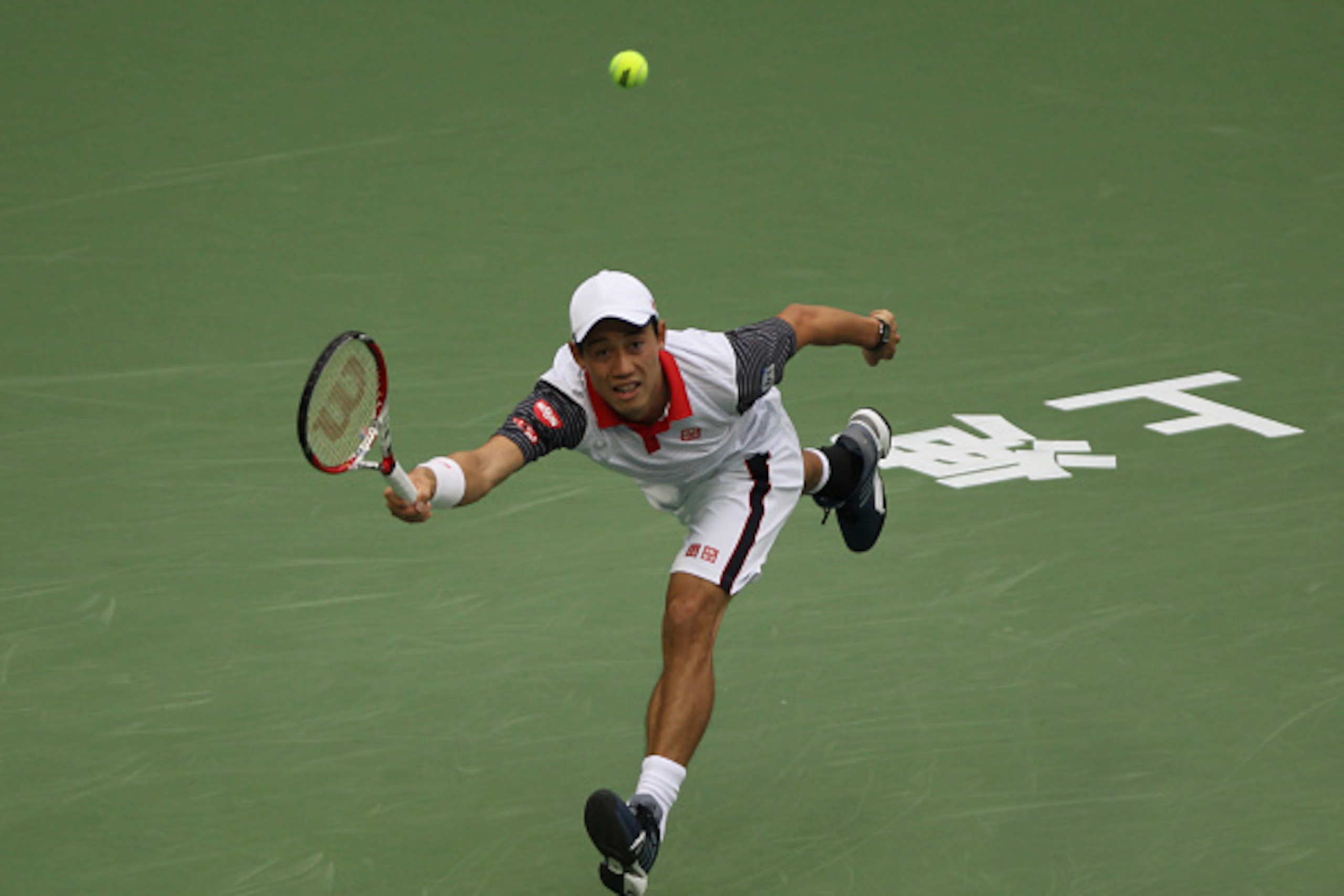 SHANGHAI, CHINA - OCTOBER 08: Kei Nishikori of Japan returns a shot during his match against Jack Sock of USA during the day 4 of the Shanghai Rolex Masters at the Qi Zhong Tennis Center on October 8, 2014 in Shanghai, China. (Photo by Zhong Zhi/Getty Ima