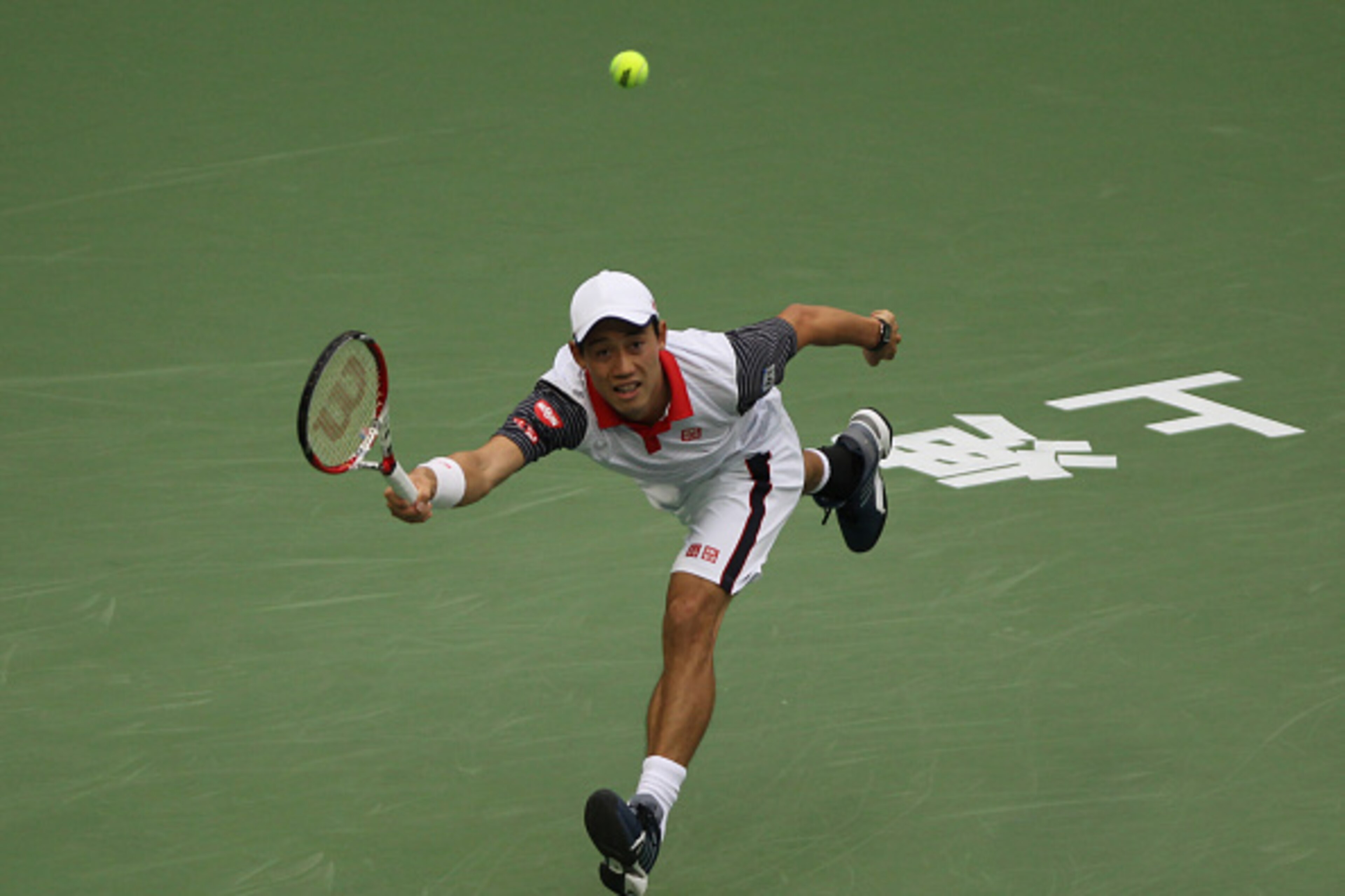SHANGHAI, CHINA - OCTOBER 08: Kei Nishikori of Japan returns a shot during his match against Jack Sock of USA during the day 4 of the Shanghai Rolex Masters at the Qi Zhong Tennis Center on October 8, 2014 in Shanghai, China. (Photo by Zhong Zhi/Getty Ima