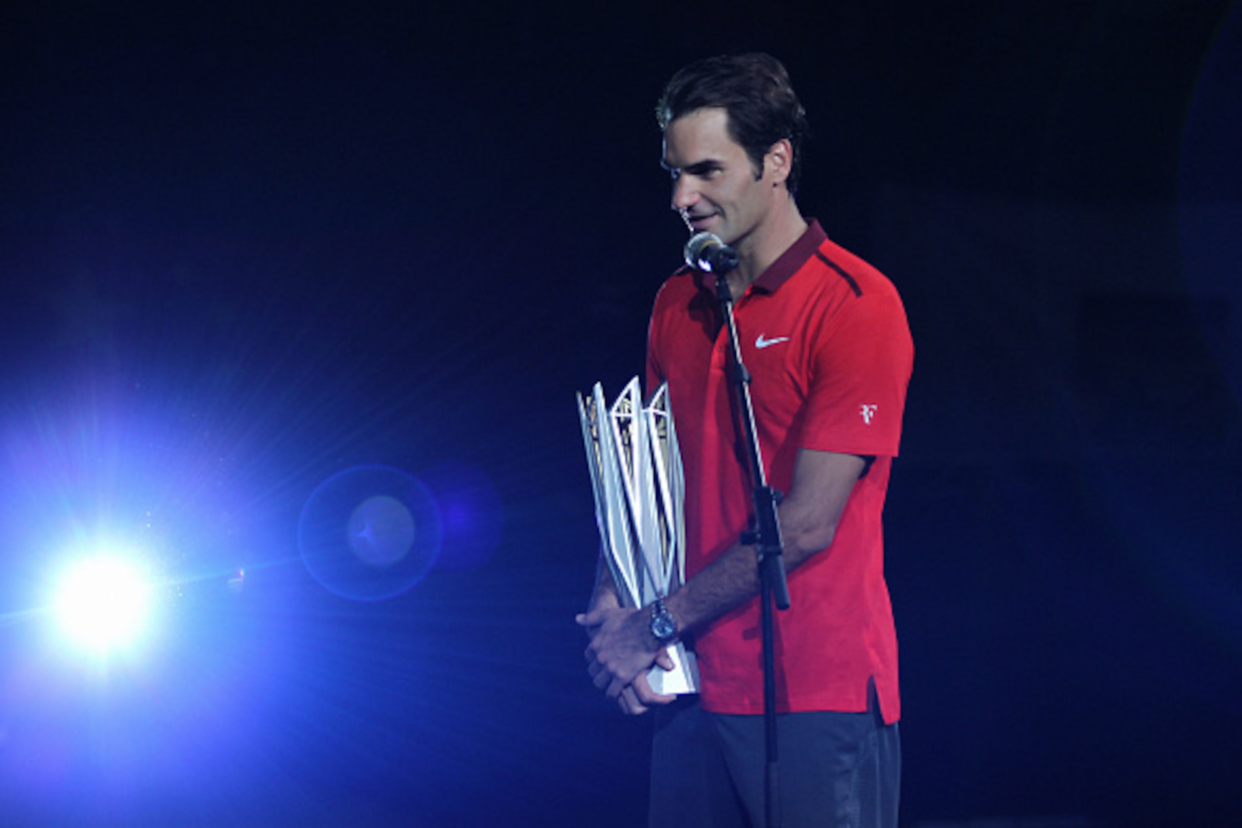 SHANGHAI, CHINA - OCTOBER 12: Roger Federer of Switzerland speeks with trophy after winning his final match against Gilles Simon of France during the day 8 of the Shanghai Rolex Masters at the Qi Zhong Tennis Center on October 12, 2014 in Shanghai, China.