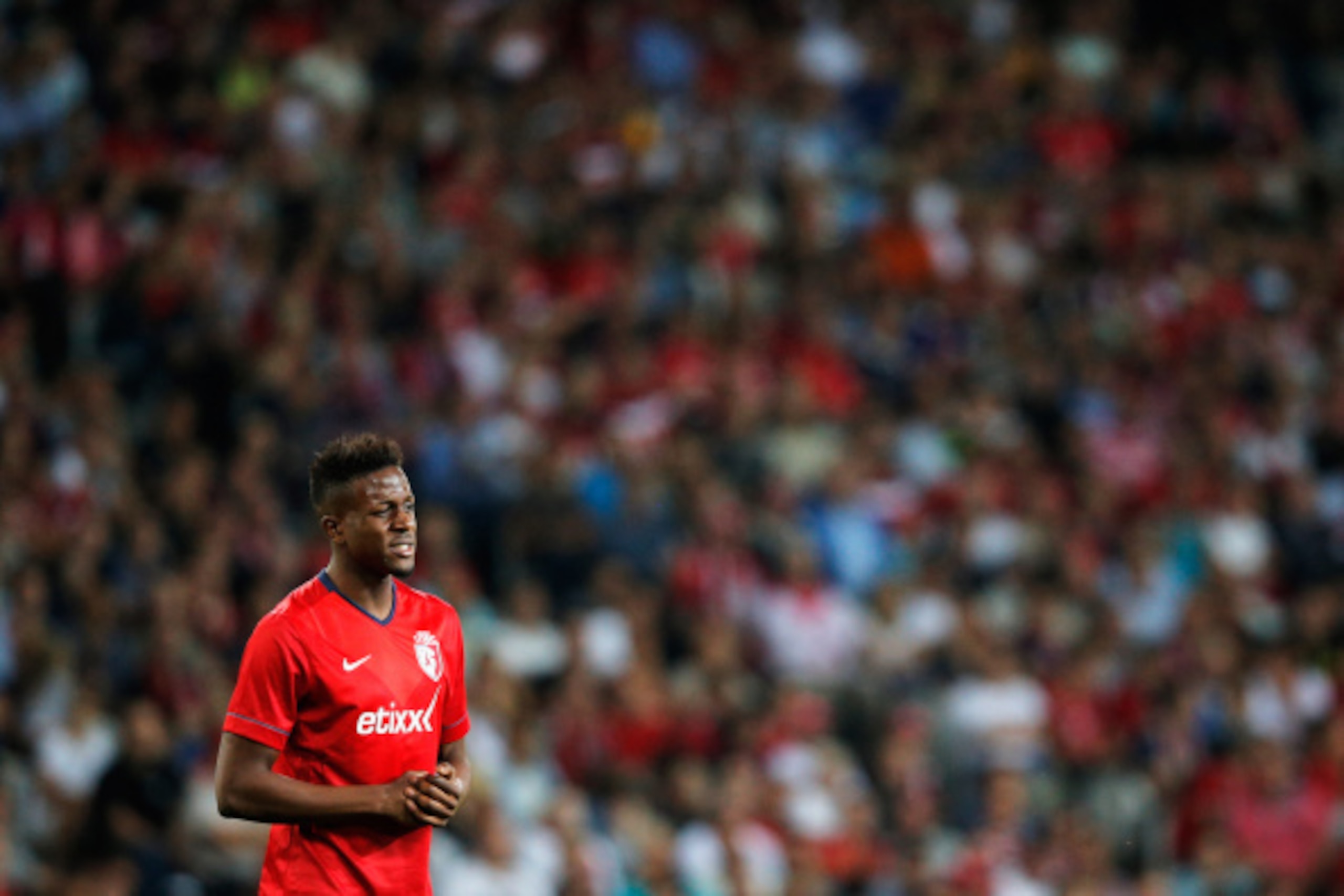 LILLE, FRANCE - AUGUST 05:  Divock Origi of Lille looks on during the UEFA Champions League third qualifying round 2nd leg match between LOSC Lille and Grasshopper Club Zurich at the Stade Pierre-Mauroy on August 5, 2014 in Lille, France.  (Photo by Dean 