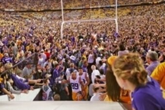 Oct 25, 2014; Baton Rouge, LA, USA; LSU Tigers tight end DeSean Smith (89) slaps hands with fans after fans storm the field following the Tigers 10-7 victory agains the Mississippi Rebels at Tiger Stadium. Mandatory Credit: Crystal LoGiudice-USA TODAY Spo