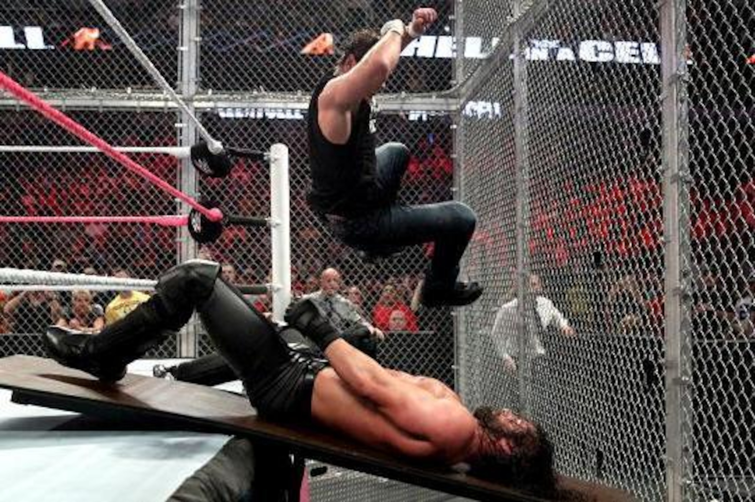 Dean Ambrose hits an elbow drop to a prone Seth Rollins.