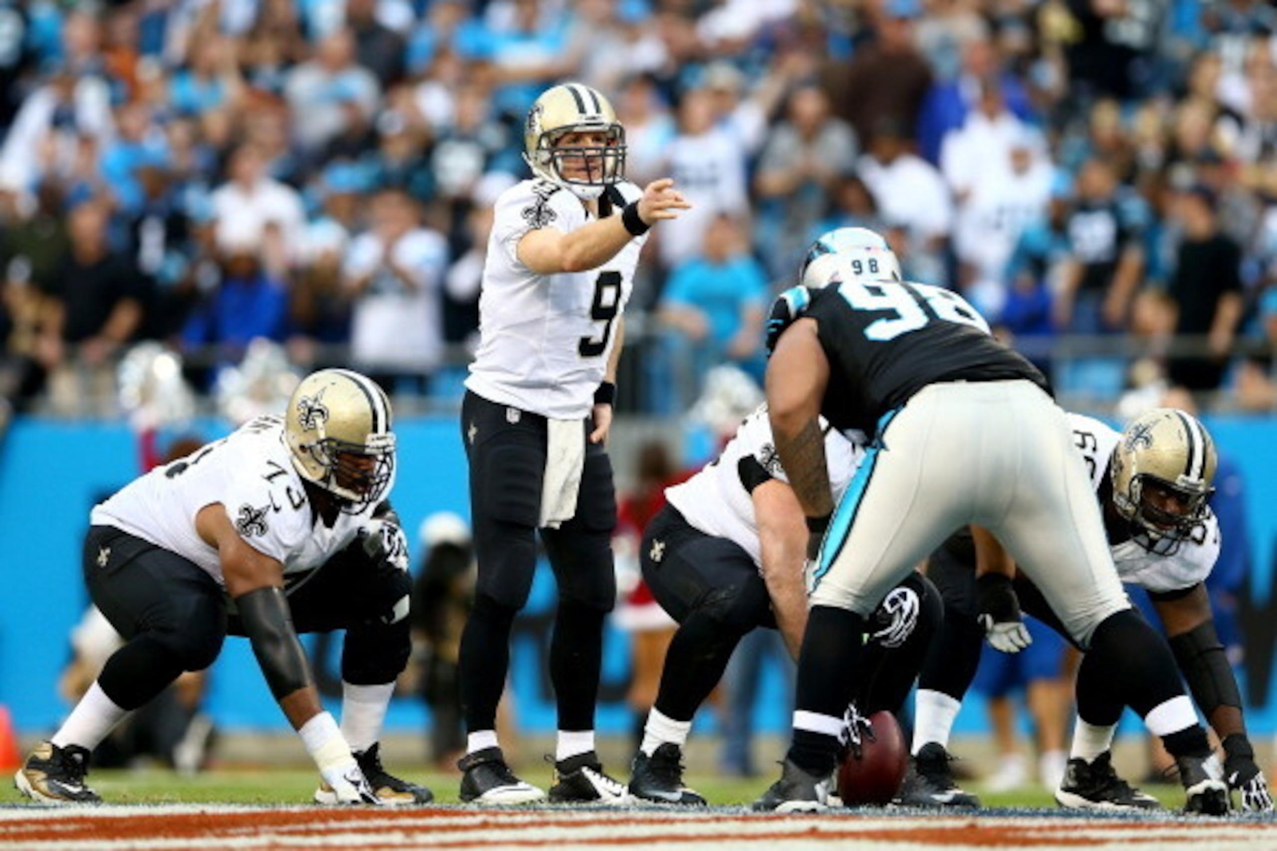 CHARLOTTE, NC - DECEMBER 22:  Drew Brees #9 of the New Orleans Saints during their game at Bank of America Stadium on December 22, 2013 in Charlotte, North Carolina.  (Photo by Streeter Lecka/Getty Images)