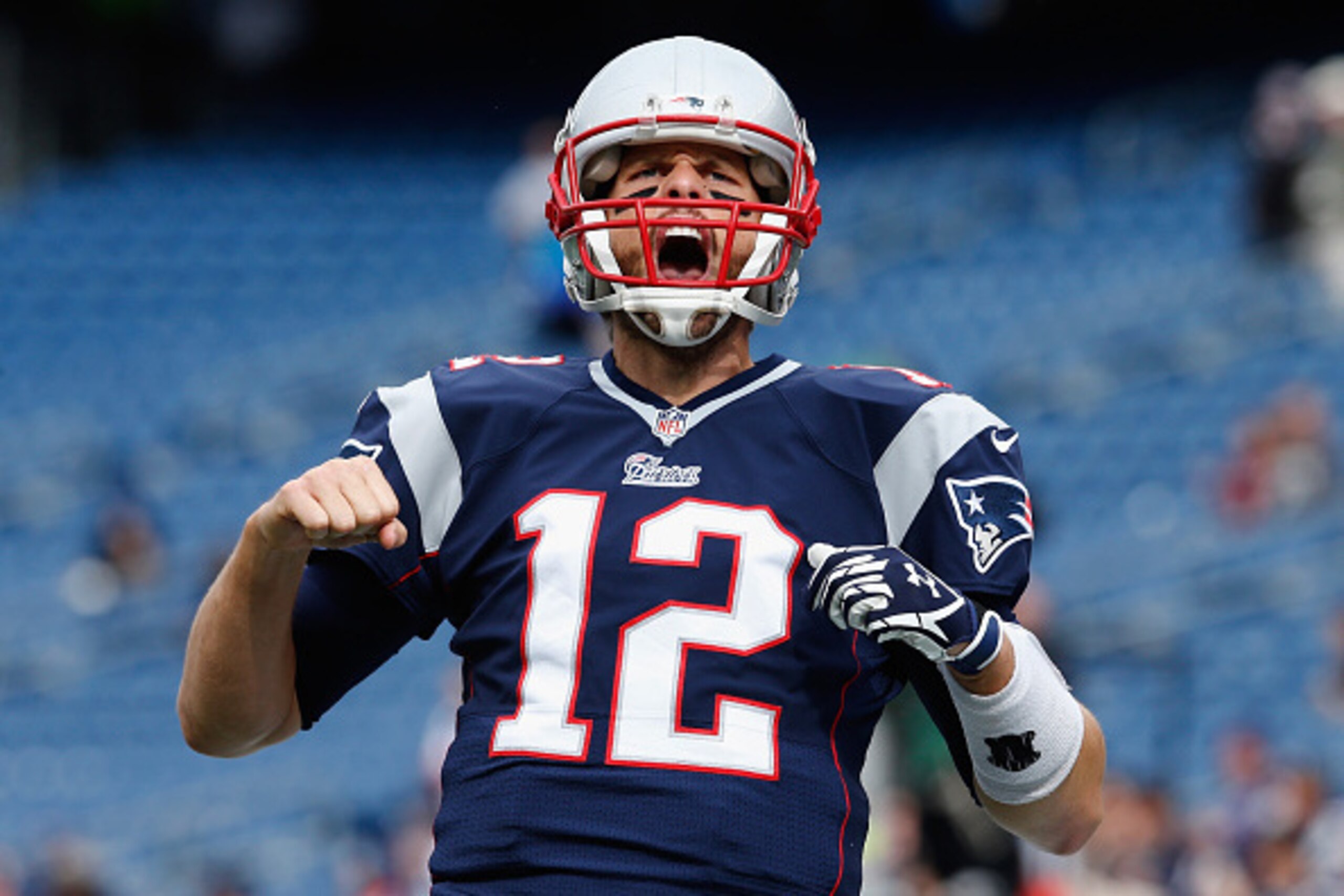 FOXBORO, MA - OCTOBER 26:  Tom Brady #12 of the New England Patriots reacts before a game against the Chicago Bears at Gillette Stadium on October 26, 2014 in Foxboro, Massachusetts.  (Photo by Jim Rogash/Getty Images)