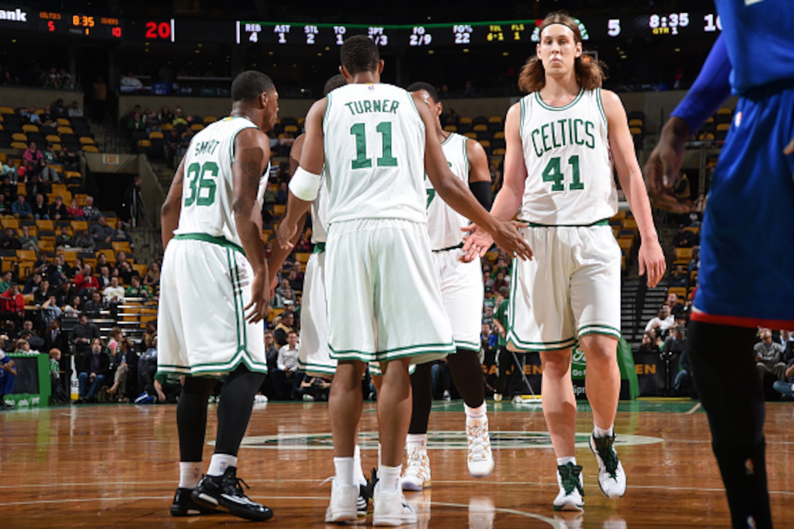 BOSTON, MA - OCTOBER 6: Kelly Olynyk #41 of the Boston Celtics high fives his team mates after a play against the Philadelphia 76ers on October 6, 2014 at the TD Garden in Boston, Massachusetts.  NOTE TO USER: User expressly acknowledges and agrees that, 