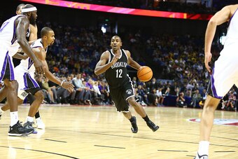 SHANGHAI, CHINA - OCTOBER 12: Marquis Teague #12 of the  Brooklyn Nets drives against the Sacramento Kings during the 2014 NBA Global Games at the Mercedes-Benz Arena on October 12, 2014 at the Mercedes-Benz Arena in Shanghai, China. NOTE TO USER: User ex