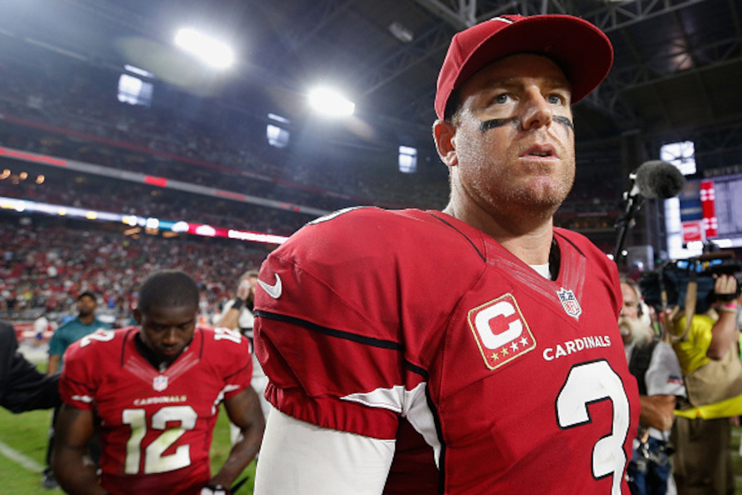 GLENDALE, AZ - OCTOBER 26:  Quarterback Carson Palmer #3 of the Arizona Cardinals walks off the field with John Brown #12 after defeating the Philadelphia Eagles in the NFL game at the University of Phoenix Stadium on October 26, 2014 in Glendale, Arizona