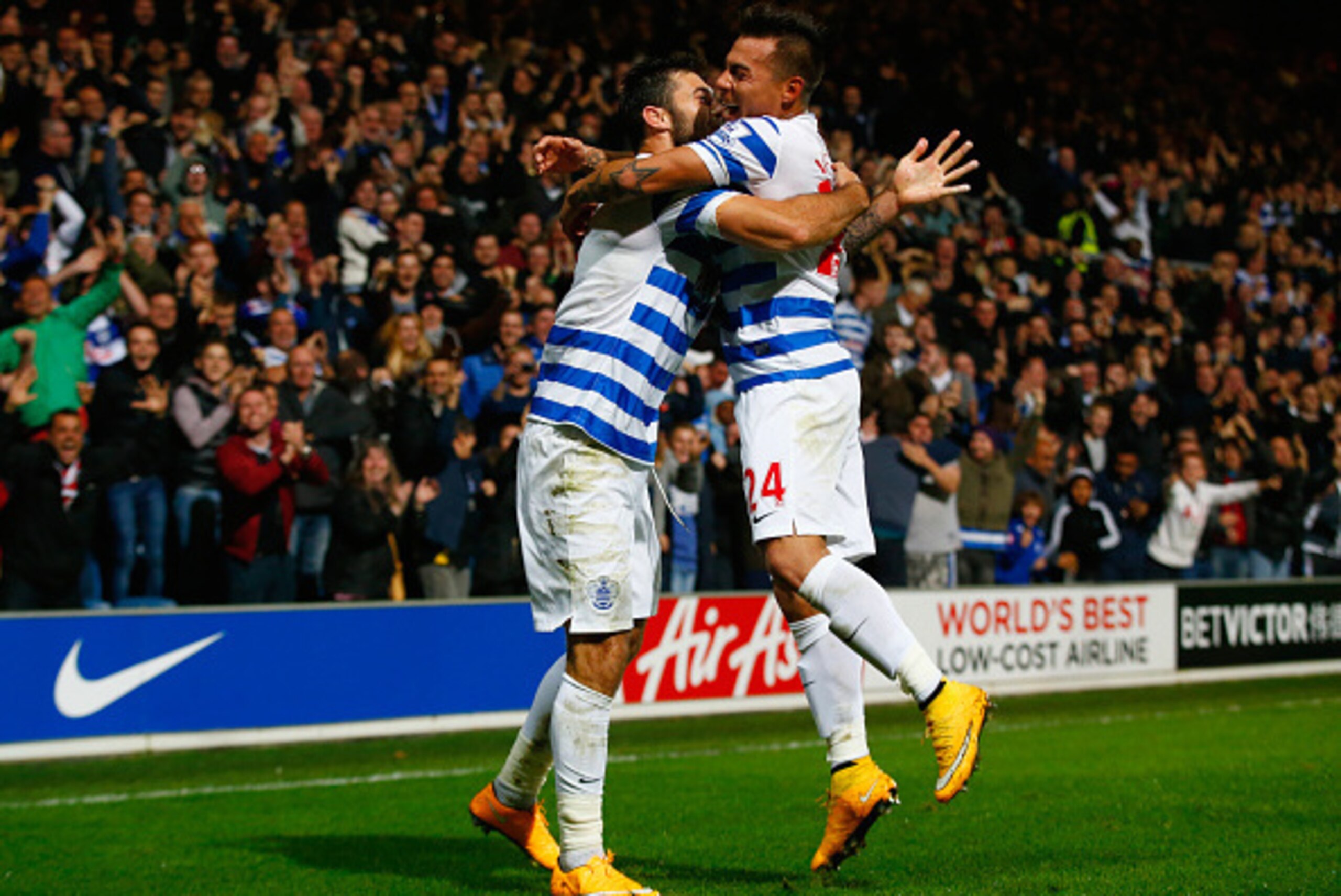 LONDON, ENGLAND - OCTOBER 27:  Charlie Austin of QPR (L) celebrates scoring their second goal with Eduardo Vargas of QPR during the Barclays Premier League match between Queens Park Rangers and Aston Villa at Loftus Road on October 27, 2014 in London, Eng