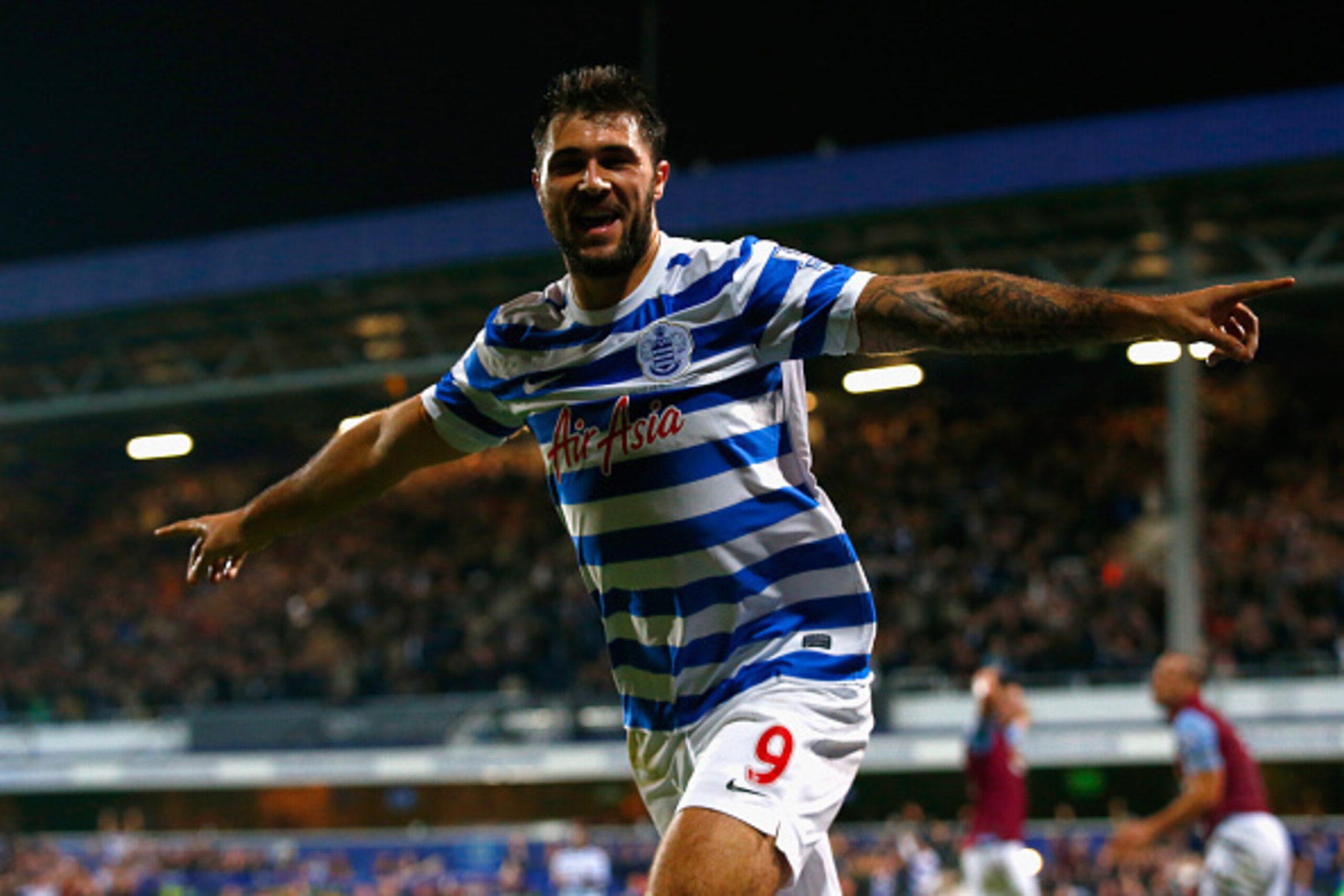 LONDON, ENGLAND - OCTOBER 27:  Charlie Austin of QPR celebrates scoring their second goal during the Barclays Premier League match between Queens Park Rangers and Aston Villa at Loftus Road on October 27, 2014 in London, England.  (Photo by Clive Rose/Get