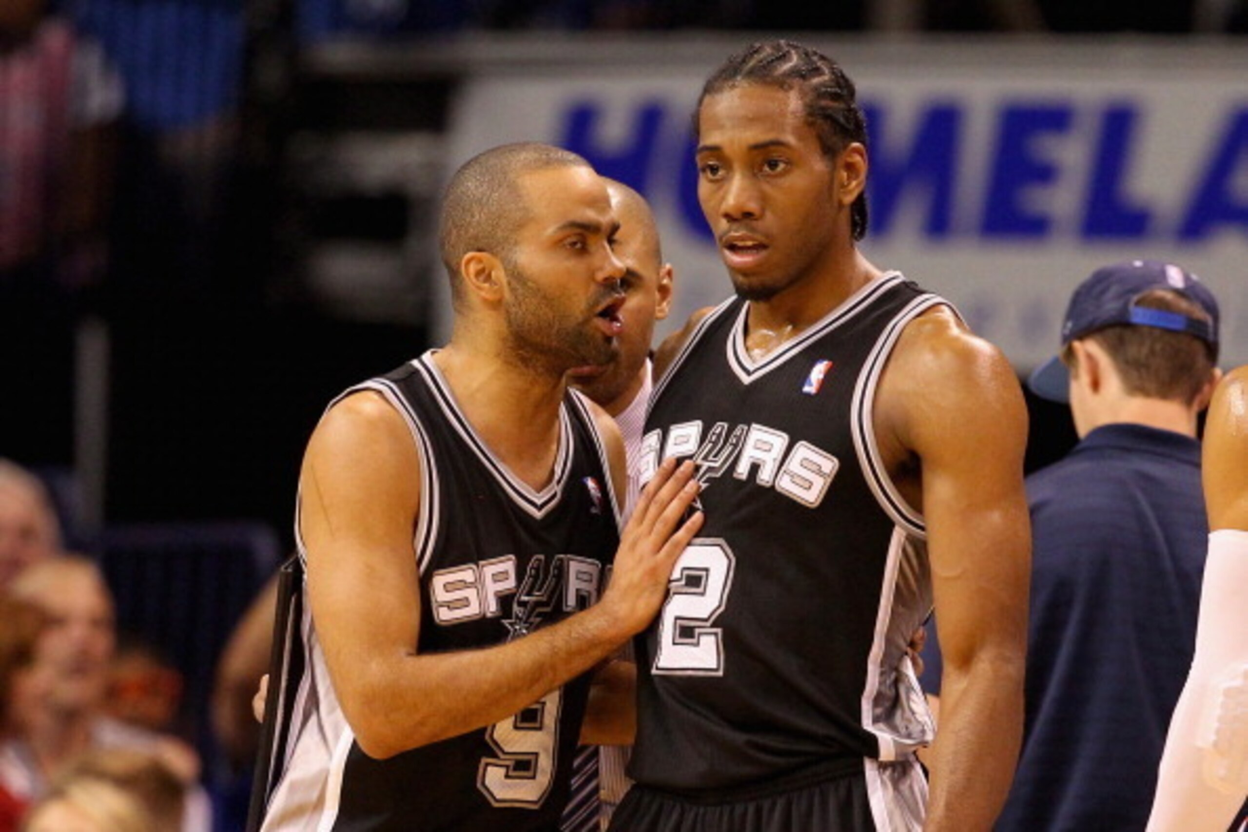 OKLAHOMA CITY, OK - MAY 25: Tony Parker #9 and Kawhi Leonard #2 of the San Antonio Spurs talk in the second quarter against the Oklahoma City Thunder during Game Three of the Western Conference Finals of the 2014 NBA Playoffs at Chesapeake Energy Arena on