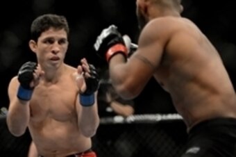 December 14, 2013; Sacramento, CA, USA; Demetrious Johnson (red gloves) fights Joseph Benavidez (blue gloves) during the flyweight championship bout of the UFC on FOX 9 at Sleep Train Arena. Johnson defeated Benavidez. Mandatory Credit: Kyle Terada-USA TO
