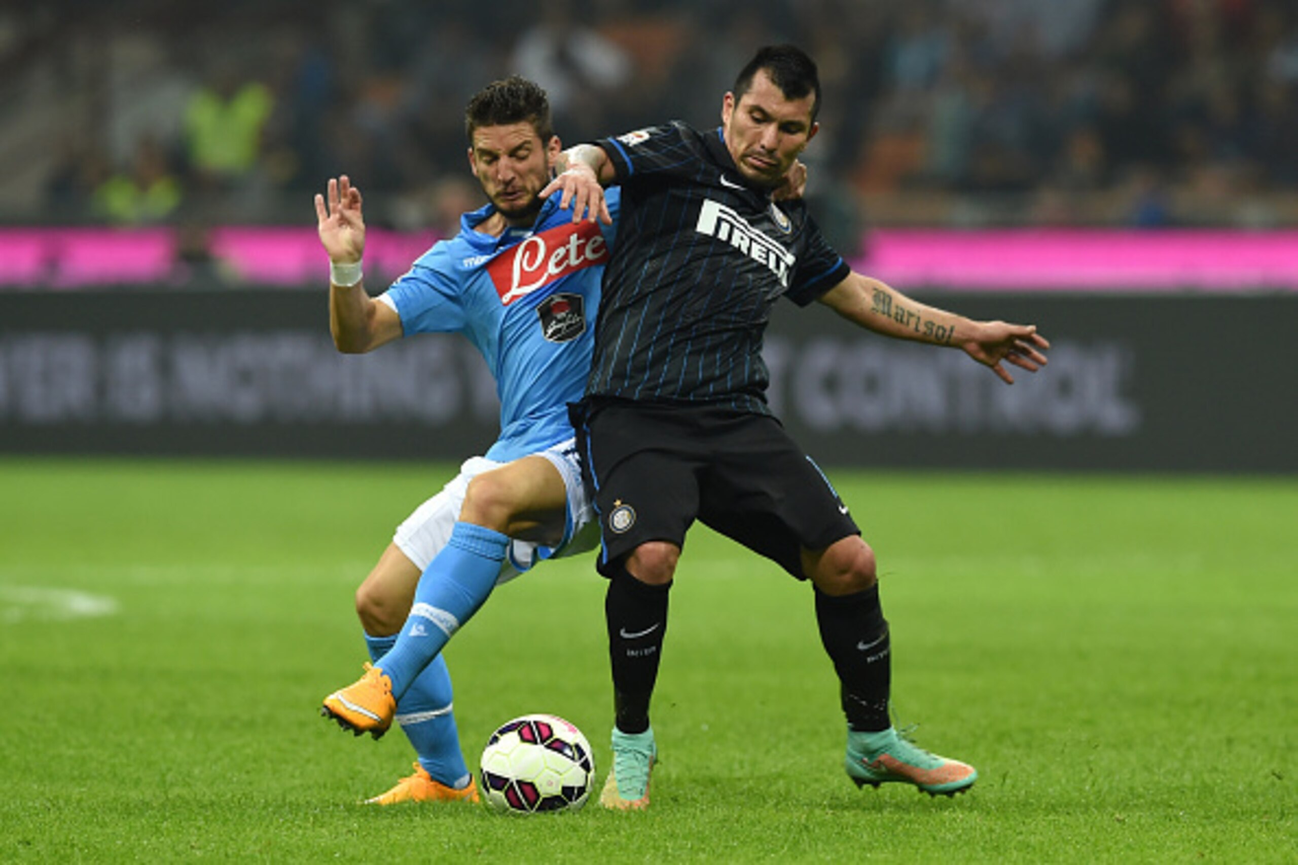MILAN, ITALY - OCTOBER 19:  Gary Alexis Medel (R) of FC Internazionale Milano is challenged by Dries Mertens of SSC Napoli during the Serie A match between FC Internazionale Milano and SSC Napoli at Stadio Giuseppe Meazza on October 19, 2014 in Milan, Ita