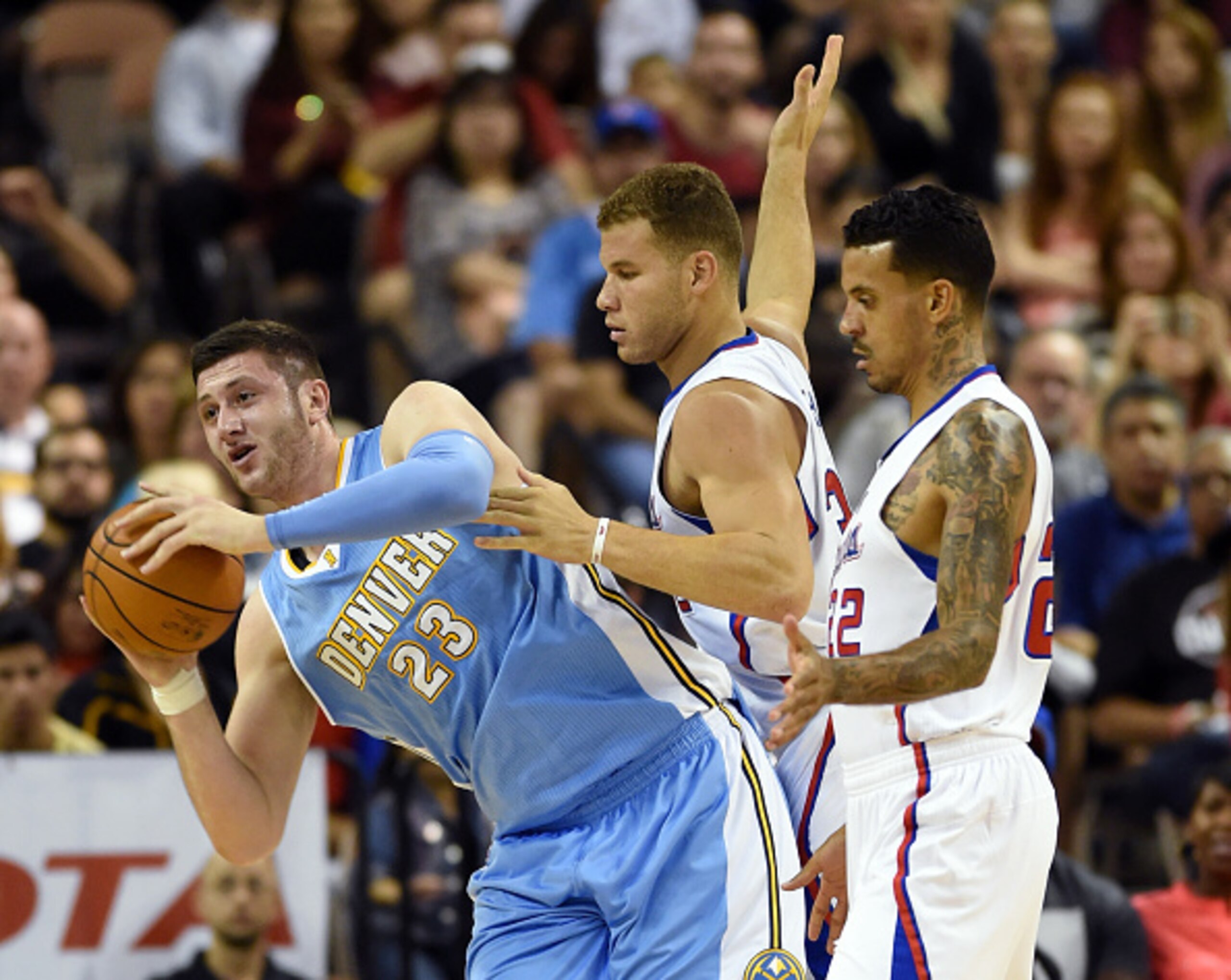 LAS VEGAS, NV - OCTOBER 18: Jusuf Nurkic #23 of the Denver Nuggets grabs a rebound against Blake Griffin #32 and Matt Barnes #22 of the Los Angeles Clippers during their preseason game at the Mandalay Bay Events Center on October 18, 2014 in Las Vegas, N LAS VEGAS, NV - OCTOBER 18: Jusuf Nurkic #23 of the Denver Nuggets grabs a rebound against Blake Griffin #32 and Matt Barnes #22 of the Los Angeles Clippers during their preseason game at the Mandalay Bay Events Center on October 18, 2014 in Las Vegas, N