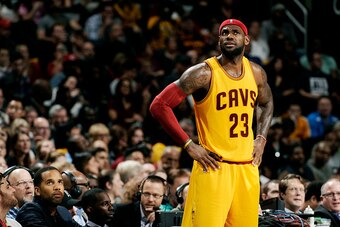 CLEVELAND, OH - OCTOBER 17:  LeBron James #23 of the Cleveland Cavaliers looks up at the scoreboard during a break in the action against the Dallas Mavericks at The Quicken Loans Arena on October 17, 2014 in Cleveland, Ohio. NOTE TO USER: User expressly a