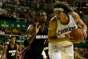 RIO DE JANEIRO, BRAZIL - OCTOBER 11: Anderson Varejao #17 of the Cleveland Cavaliers drives against Chris Bosh #1 of the Miami Heat at HSBC Arena on October 11, 2014 in Rio de Janeiro, Brazil. NOTE TO USER: User expressly acknowledges and agrees that, by 