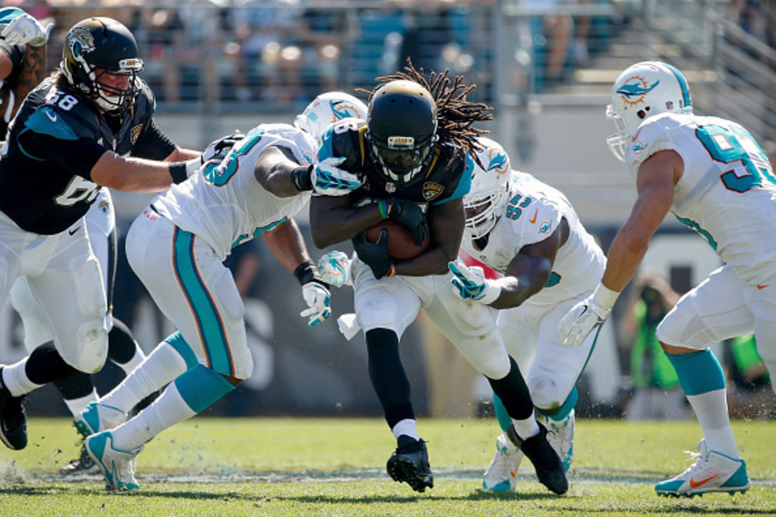 JACKSONVILLE, FL - OCTOBER 26: Denard Robinson #16 of the Jacksonville Jaguars carries during the first quarter of the game against the Miami Dolphins at EverBank Field on October 26, 2014 in Jacksonville, Florida. (Photo by Rob Foldy/Getty Images) JACKSONVILLE, FL - OCTOBER 26: Denard Robinson #16 of the Jacksonville Jaguars carries during the first quarter of the game against the Miami Dolphins at EverBank Field on October 26, 2014 in Jacksonville, Florida. (Photo by Rob Foldy/Getty Images)
