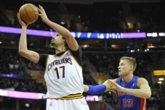 Apr 9, 2014; Cleveland, OH, USA; Cleveland Cavaliers center Anderson Varejao (17) shoots the ball in front of Detroit Pistons forward Jonas Jerebko (33) in the third quarter at Quicken Loans Arena. Mandatory Credit: David Richard-USA TODAY Sports