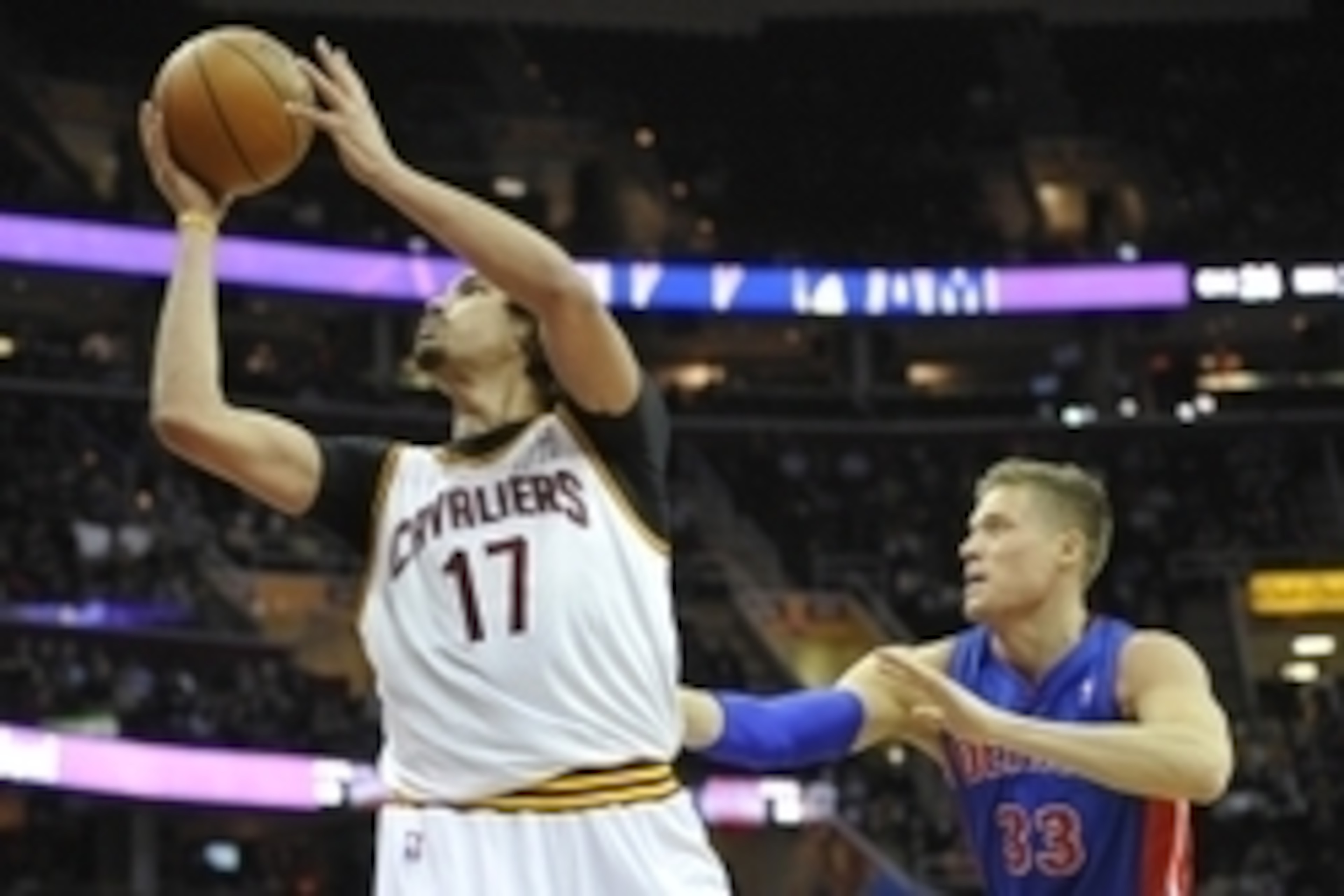 Apr 9, 2014; Cleveland, OH, USA; Cleveland Cavaliers center Anderson Varejao (17) shoots the ball in front of Detroit Pistons forward Jonas Jerebko (33) in the third quarter at Quicken Loans Arena. Mandatory Credit: David Richard-USA TODAY Sports