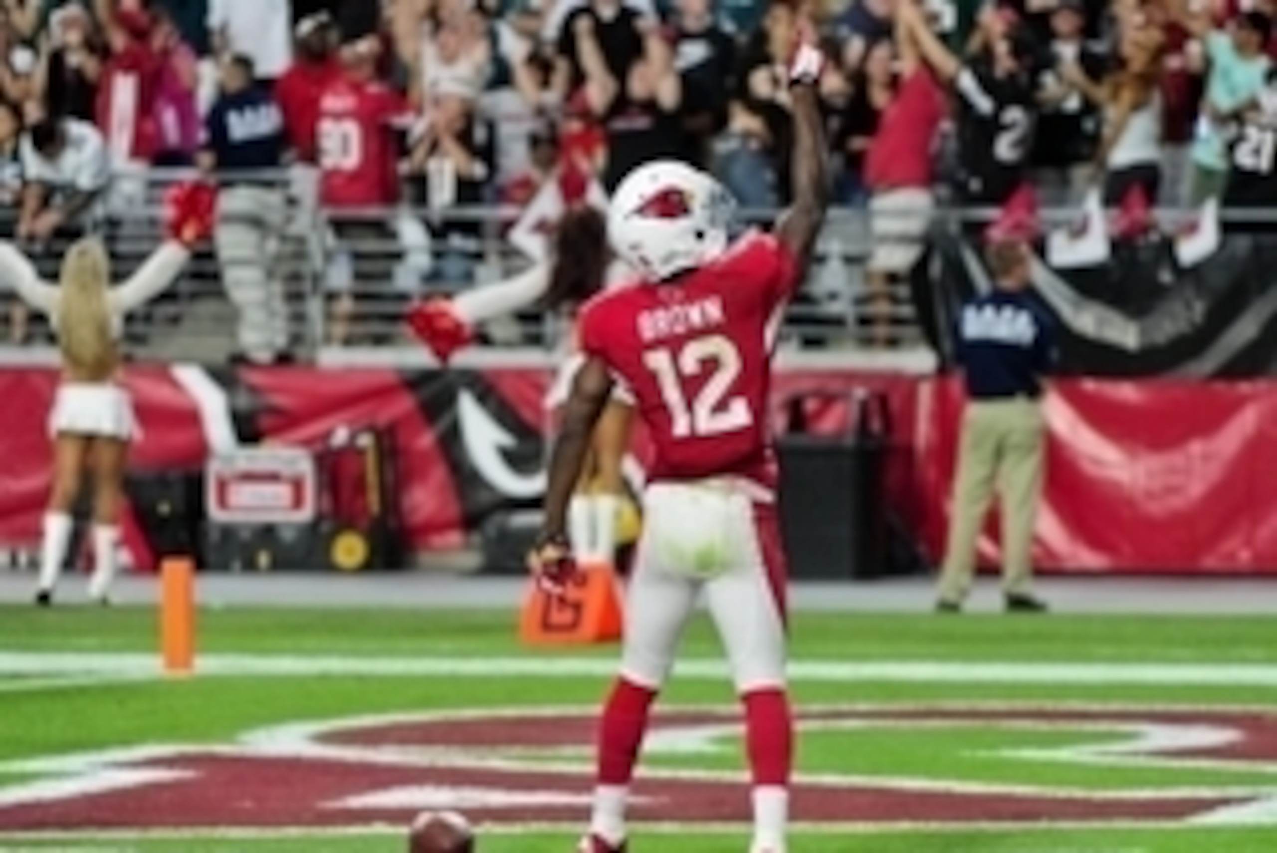 Oct 26, 2014; Glendale, AZ, USA; Arizona Cardinals wide receiver John Brown (12) celebrates by dancing after a 75 yard touchdown during the second half against the Philadelphia Eagles at University of Phoenix Stadium. Mandatory Credit: Matt Kartozian-USA 