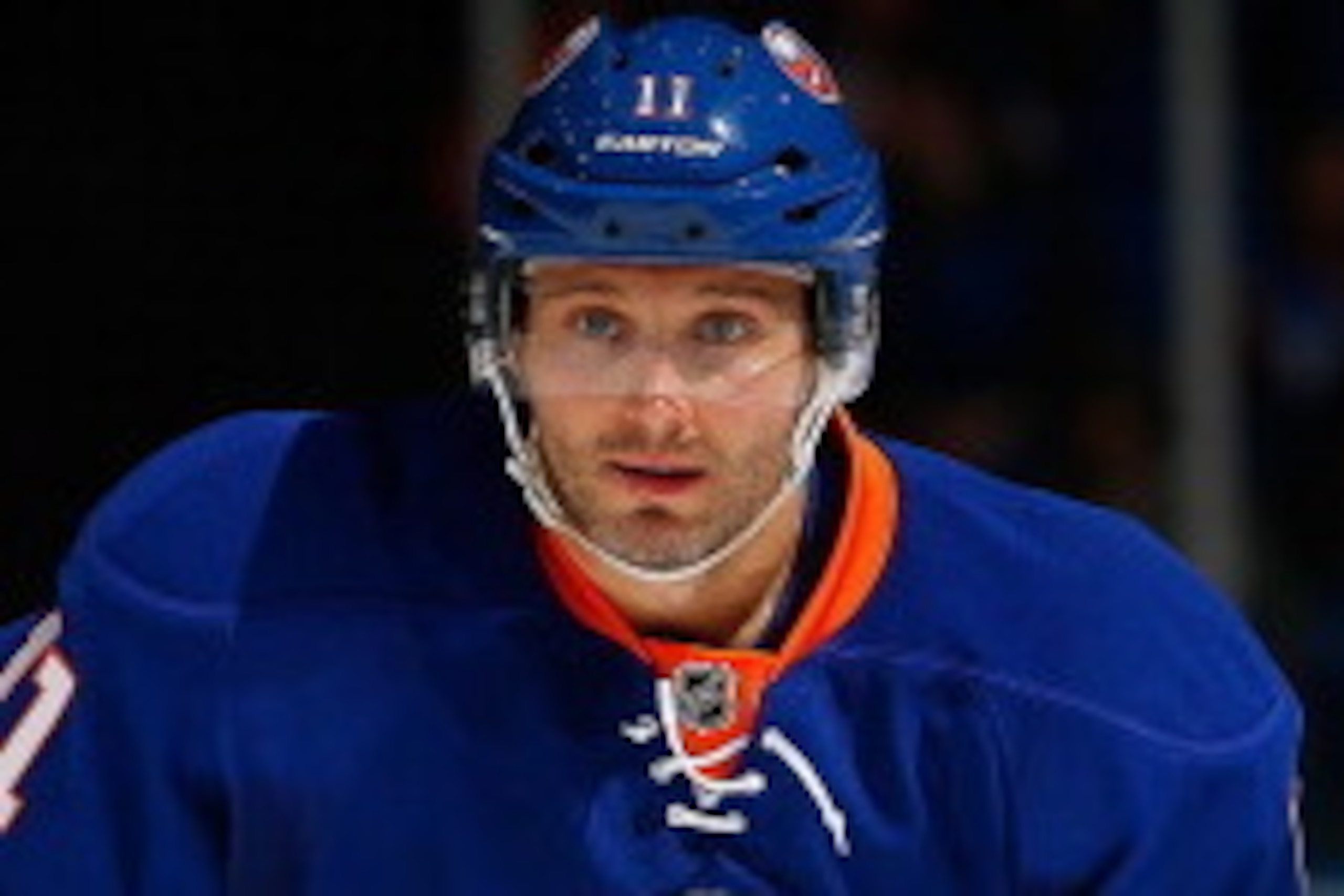 UNIONDALE, NY - MARCH 14:  Lubomir Visnovsky #11 of the New York Islanders skates against the San Jose Sharks at Nassau Veterans Memorial Coliseum on March 14, 2014 in Uniondale, New York. The Sharks defeated the Islanders 4-3.  (Photo by Mike Stobe/NHLI 
