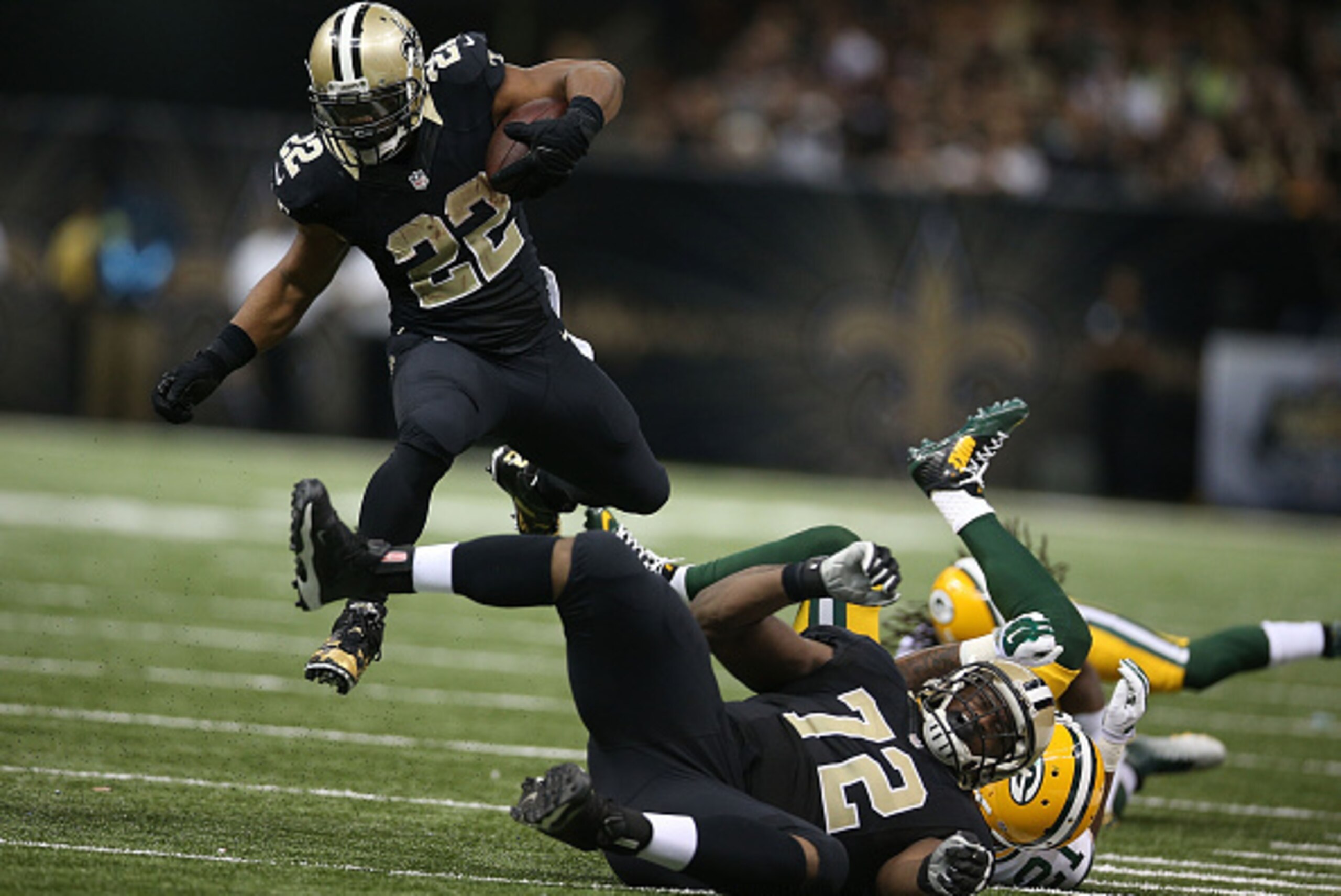 NEW ORLEANS, LA - OCTOBER 26:  Mark Ingram #22 of the New Orleans Saints runs the ball during the second half against the Green Bay Packers at Mercedes-Benz Superdome on October 26, 2014 in New Orleans, Louisiana.  (Photo by Chris Graythen/Getty Images)
