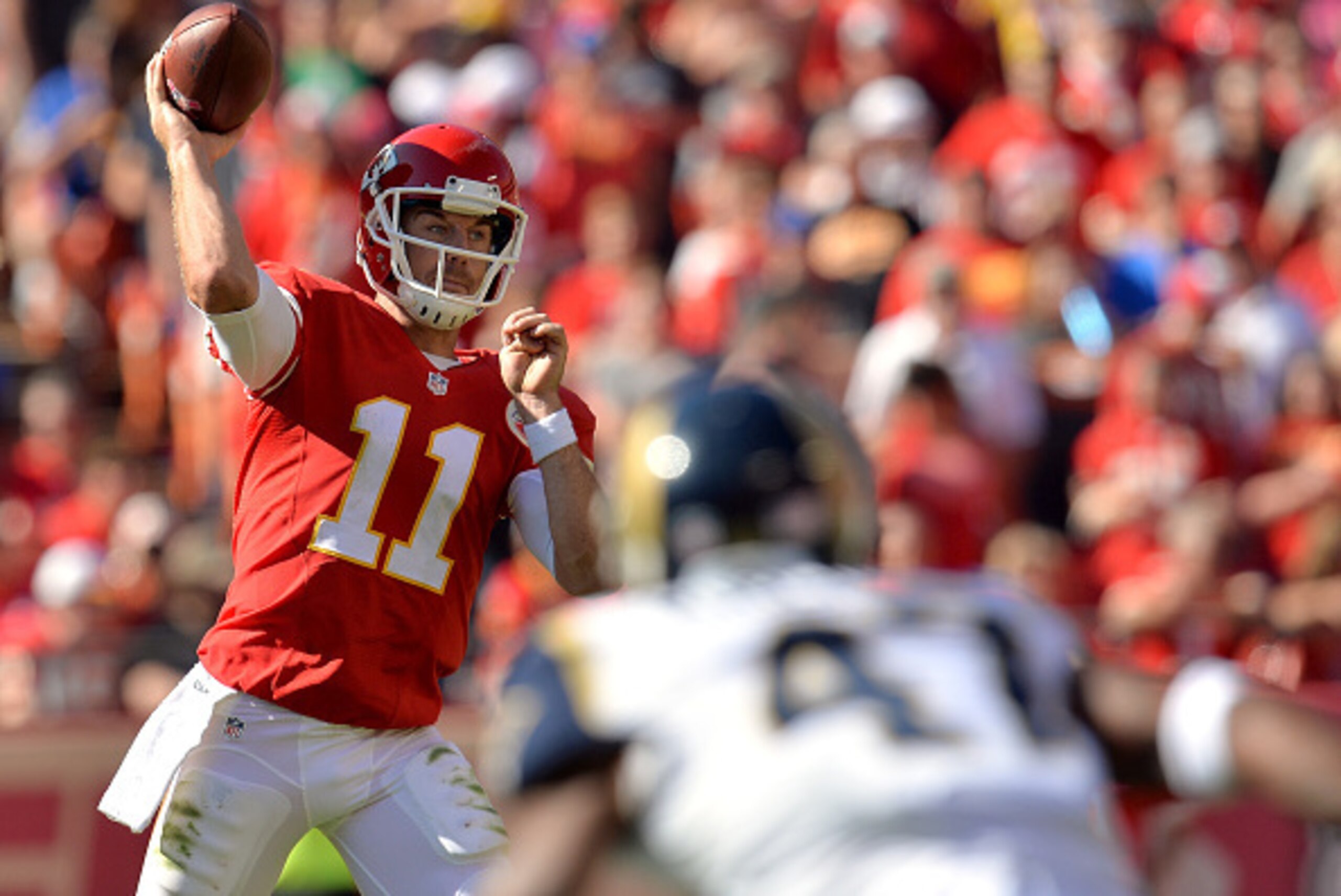 KANSAS CITY, MO - OCTOBER 26:   Alex Smith #11 of the Kansas City Chiefs passes against the St. Louis Rams at Arrowhead Stadium on October 26, 2014 in Kansas City, Missouri.  (Photo by Peter Aiken/Getty Images)