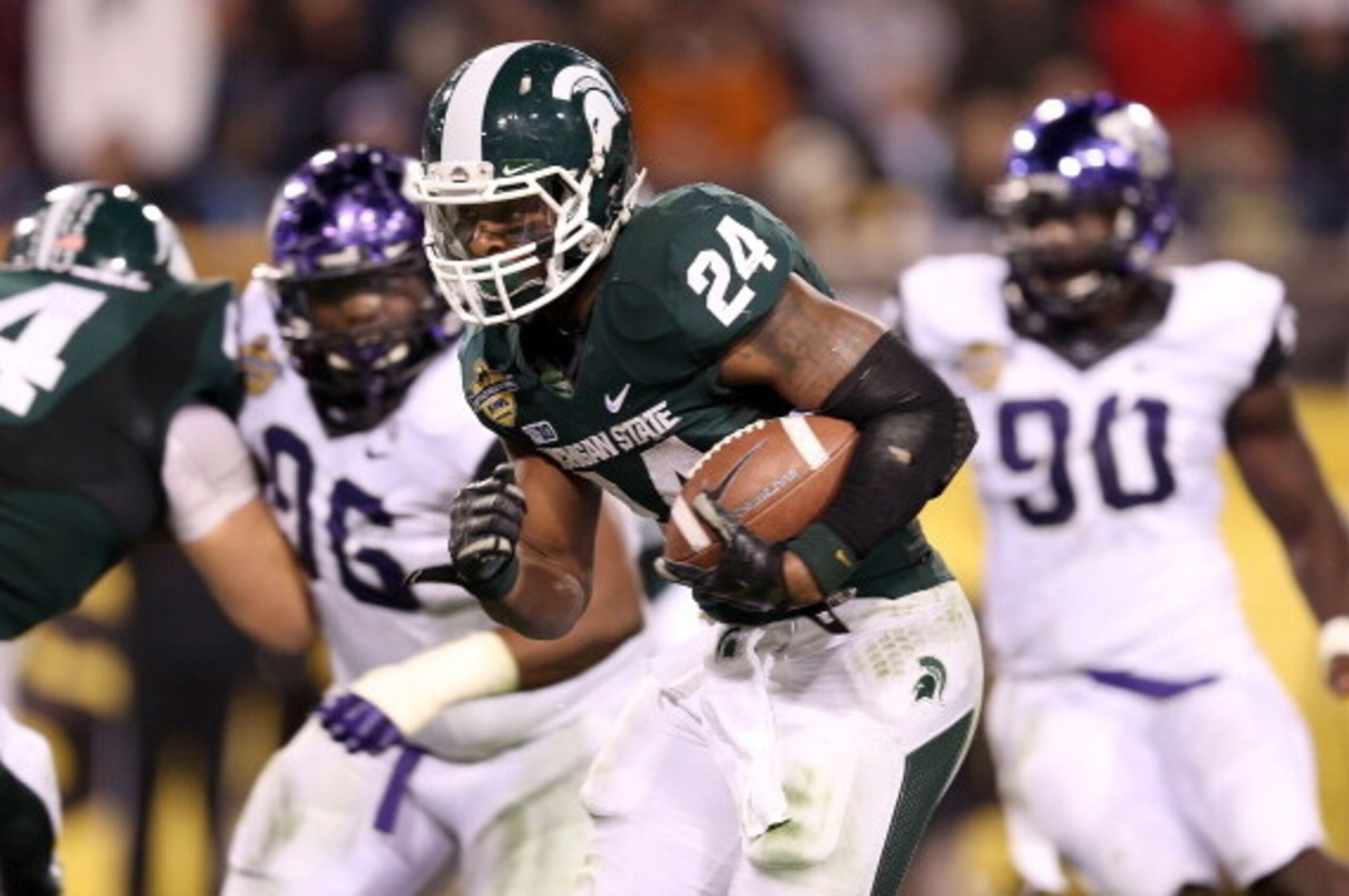 TEMPE, AZ - DECEMBER 29:  Running back Le'Veon Bell #24 of the Michigan State Spartans rushes the football against the TCU Horned Frogs during the Buffalo Wild Wings Bowl at Sun Devil Stadium on December 29, 2012 in Tempe, Arizona.  The Spartans defeated 