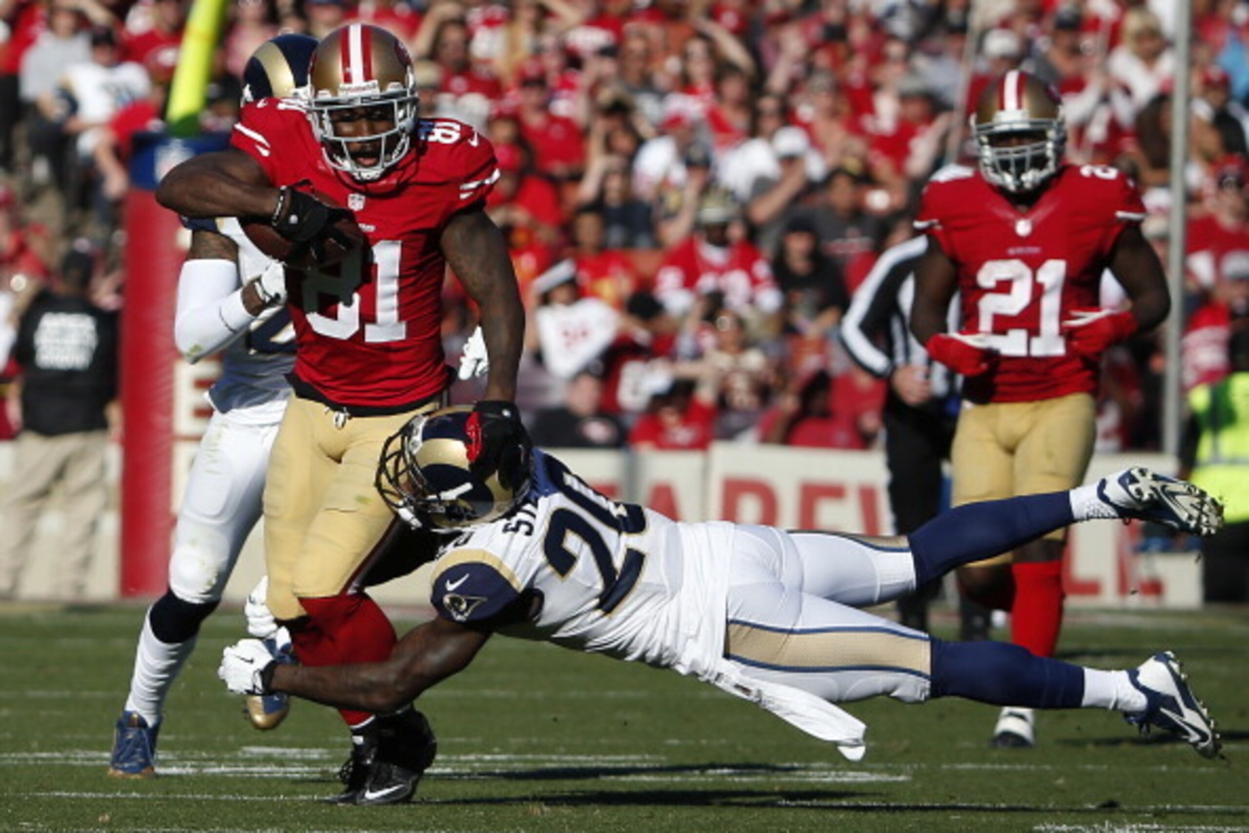 SAN FRANCISCO, CA - DECEMBER 1: Wide receiver Anquan Boldin #81 of the San Francisco 49ers rushes up the field as safety Darian Stewart #20 of the St. Louis Rams defends during the second quarter of their game on December 1, 2013 at Candlestick Park in Sa