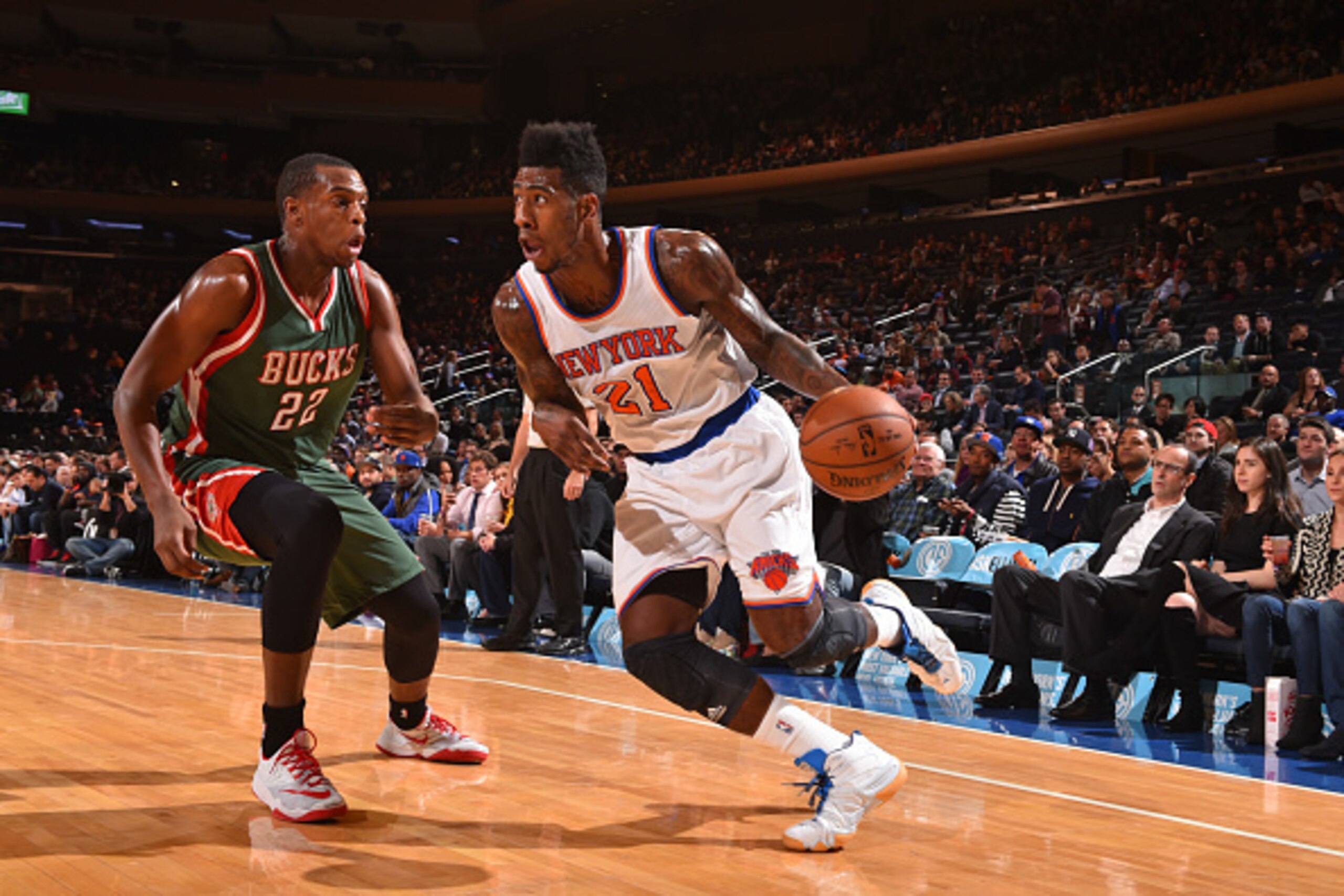 NEW YORK, NY - OCTOBER 20:  Iman Shumpert #21 of the New York Knicks handles the ball against Khris Middleton #22 of the Milwaukee Bucks on October 20, 2014 at Madison Square Garden in New York City. NOTE TO USER: User expressly acknowledges and agrees th